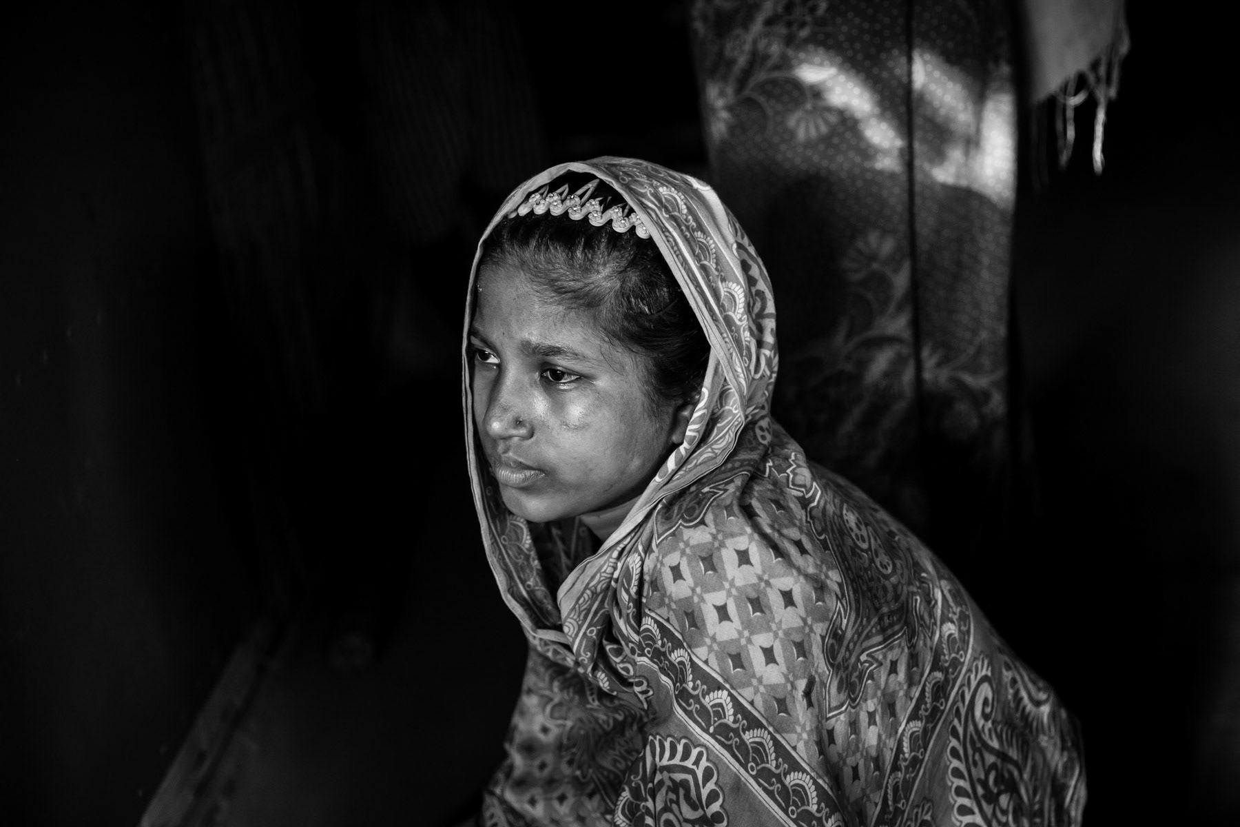 Munuara, 17 years old, is from a village near Rathidaung. Her husband was killed by the Myanmar military, she came to Bangladesh with her neighbour after that. She was beaten and gang-raped for 5 days by military in barracks near Rathidaung. Twenty other Rohingya girls were also present in the building and raped by a group of approx 30 military. She escaped after the military moved on to another location. Countless rape allegations have been consistently reported during the past months, an accusation the Myanmar authorities deny. Mass rape is often used during ethnic cleansing campaigns, both acts consitute crimes against humanity and war crimes when carried out by military personnel. Shamlapur refugee camp, Bangladesh, May 2017