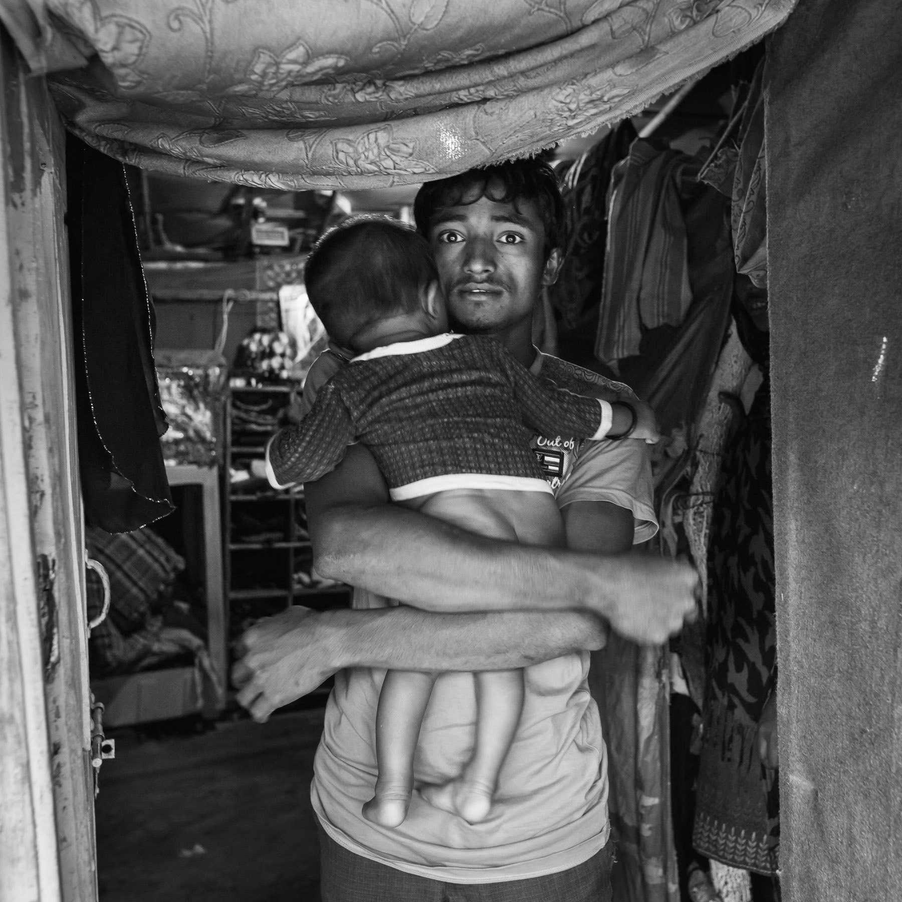 Father and his child, Baba Nagar Rohingya settlement in Hyderabad, India, June 2016