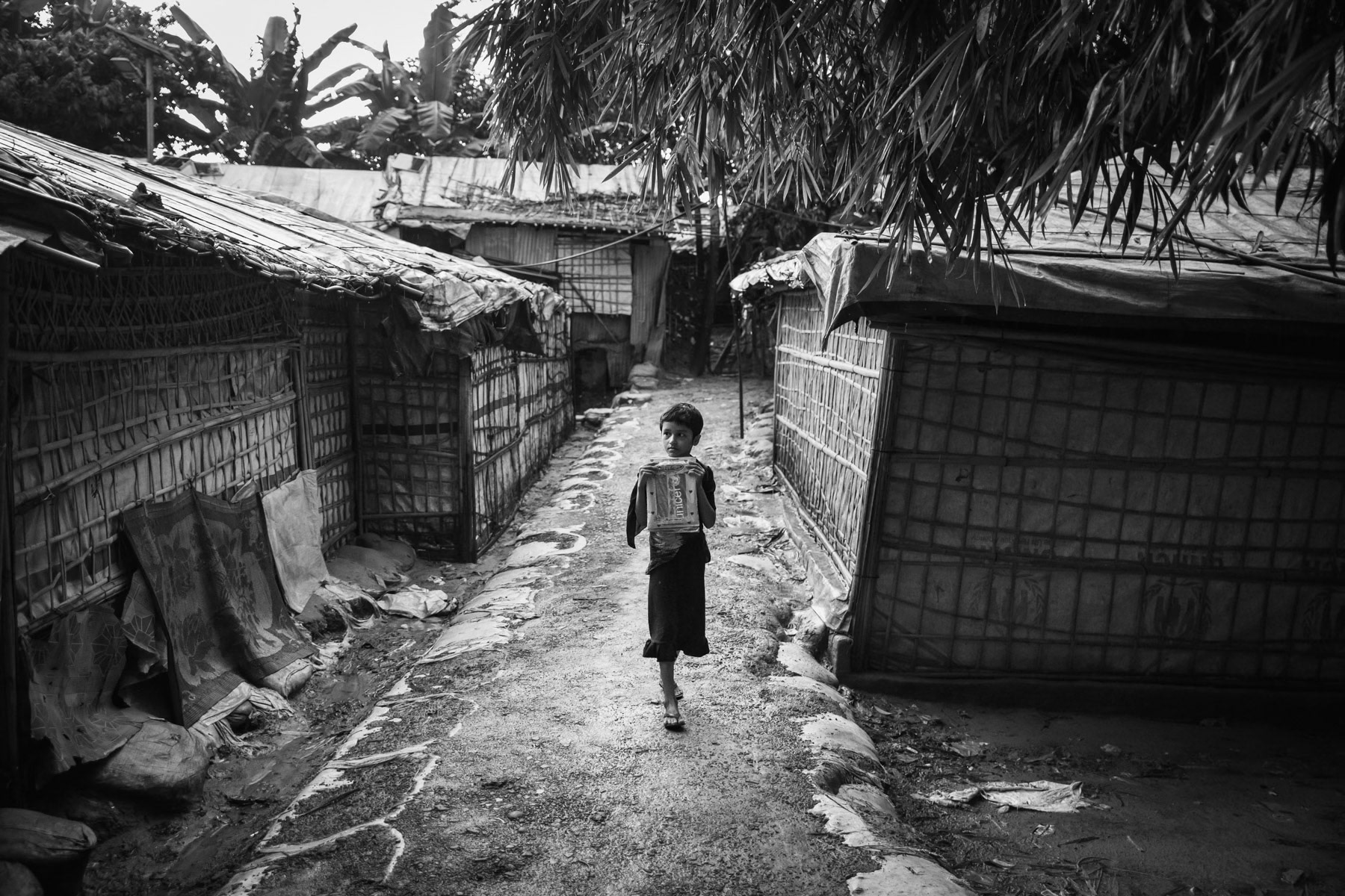 Rohingya girl going to the medresa, the religious school. Most other forms of education have slowly been suppressed and access to local schools is prohibited for Rohingya children. Kutupalong refugee camp, Bangladesh, September 2022