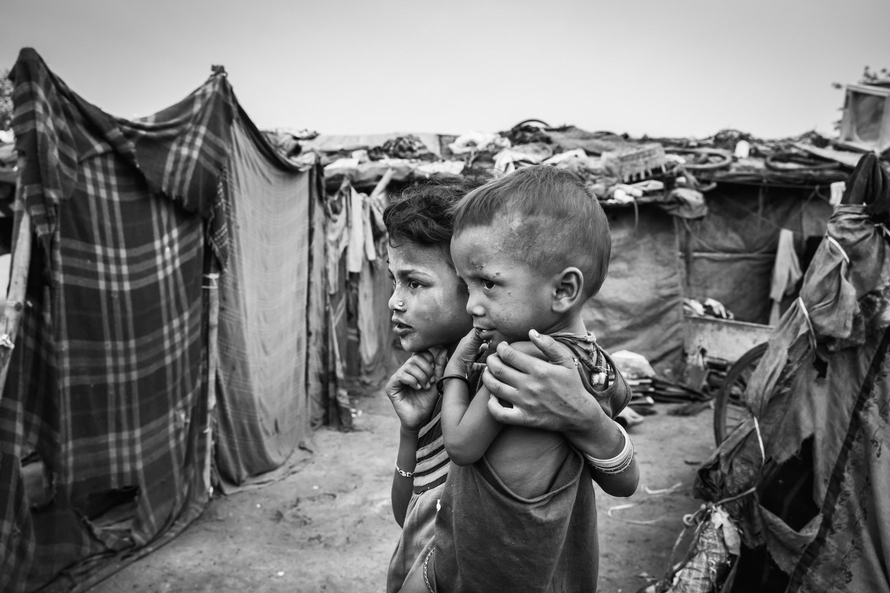 Burana bonded labour camp where 37 Rohingya families are enslaved and "owned" by a local contractor controlling waste picking and recycling in the area. The ones victim of bonded labour are extremely vulnerable and face an almost impossible task to buy themselves out of this situation. Although illigal, bonded labour practices are still widespread and rarely stopped by the authorities. Faridabad in Haryana, India, June 2017