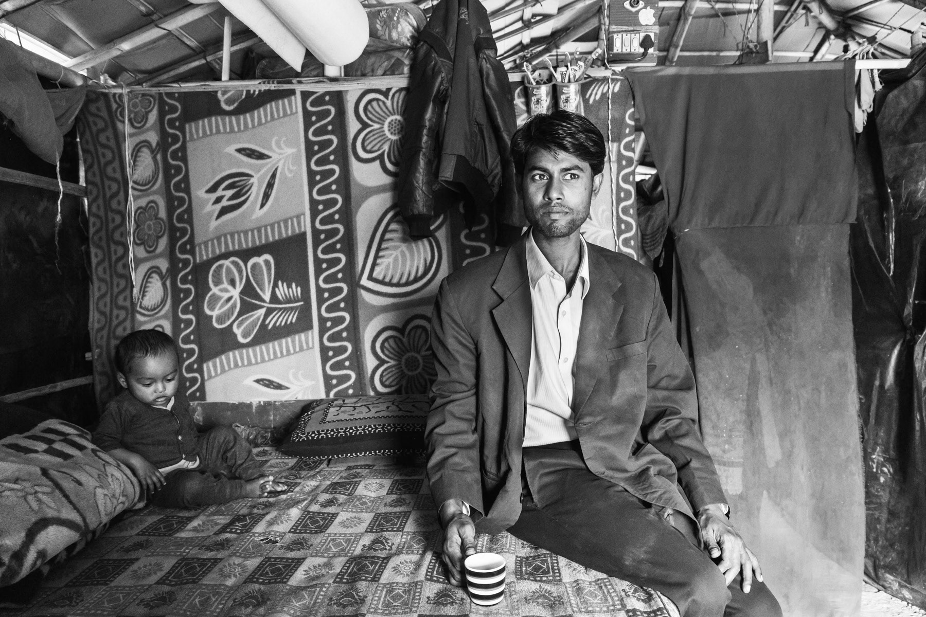 Father and son, Sharam Vihar makeshift camp for Rohingya refugees in the outskirts of New Delhi, India, January 2016