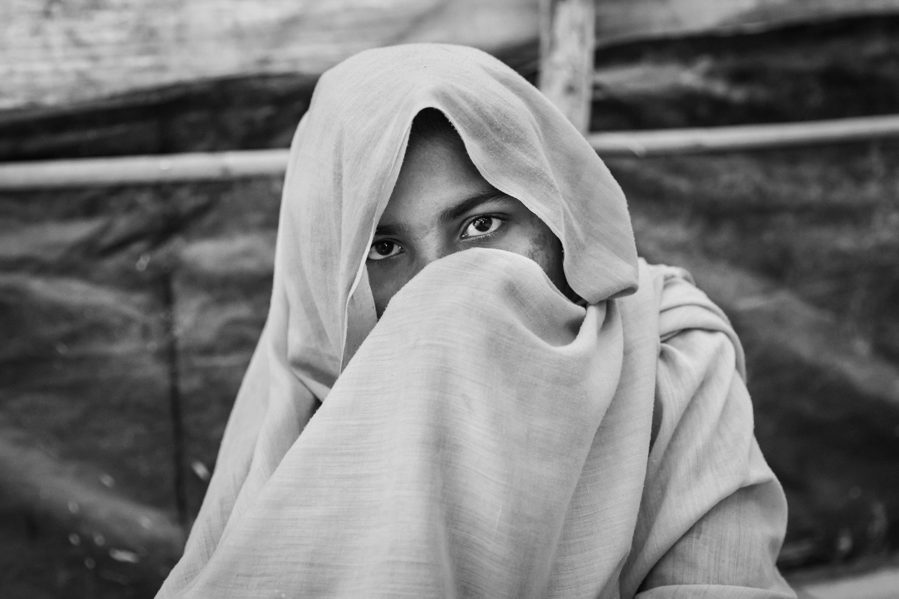 Another rape victim of the ongoing ethnc cleansing campaign in Rakhine against the Rohingya muslim minority. Fled to Bangladesh few weeks earlier and is now stranded in a refugee camp where humanitarian aid, medical care and psychological support have not yet started despite the accute crisis. Kutupalong refugee camp, Cox's Bazar, Bangladesh, February 2017