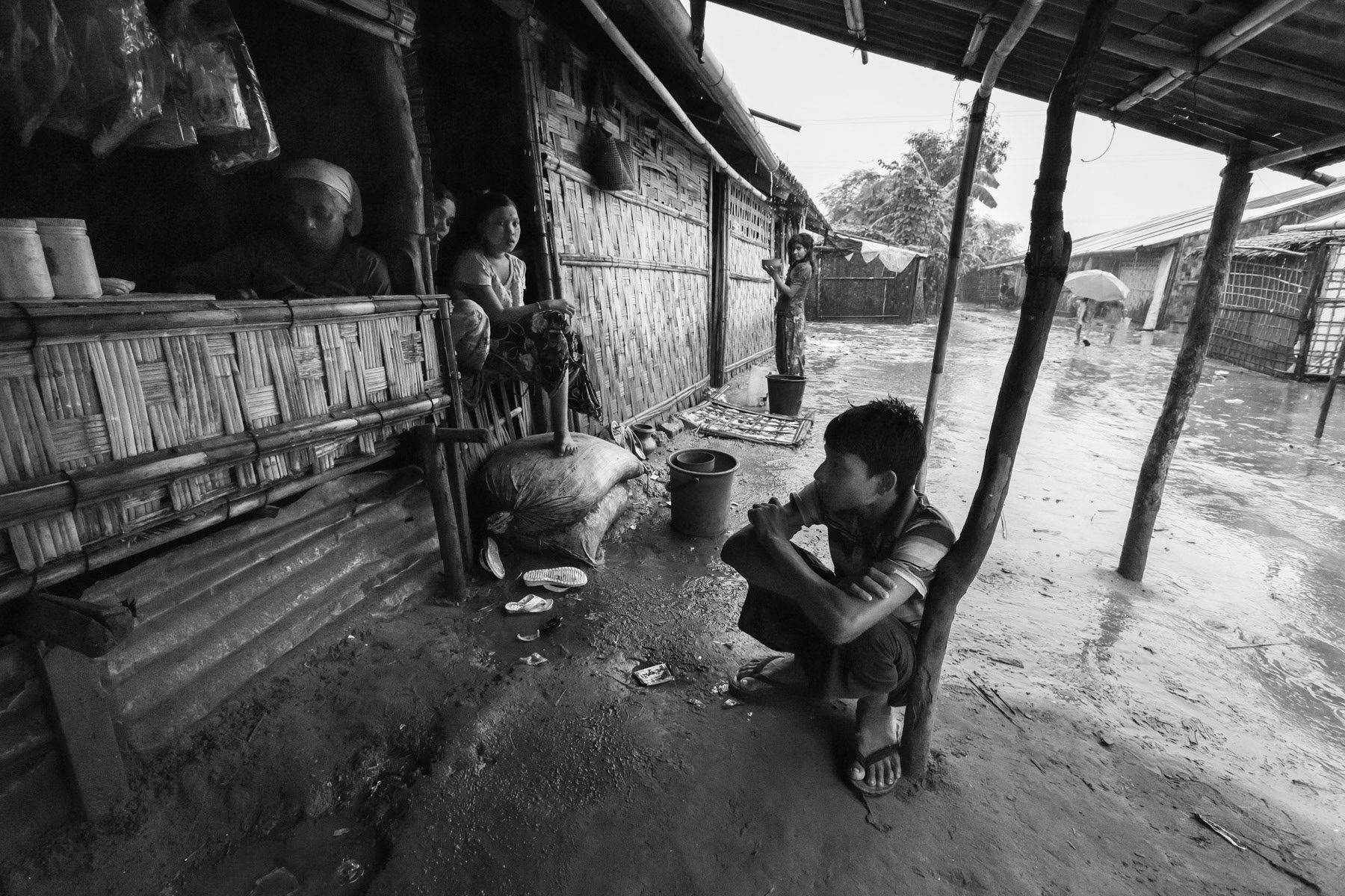Waiting for the rain to pass, Baw Du Pha IDP camp for foribly displaced Rohingya, Sittwe township, Myanmar, October 2016