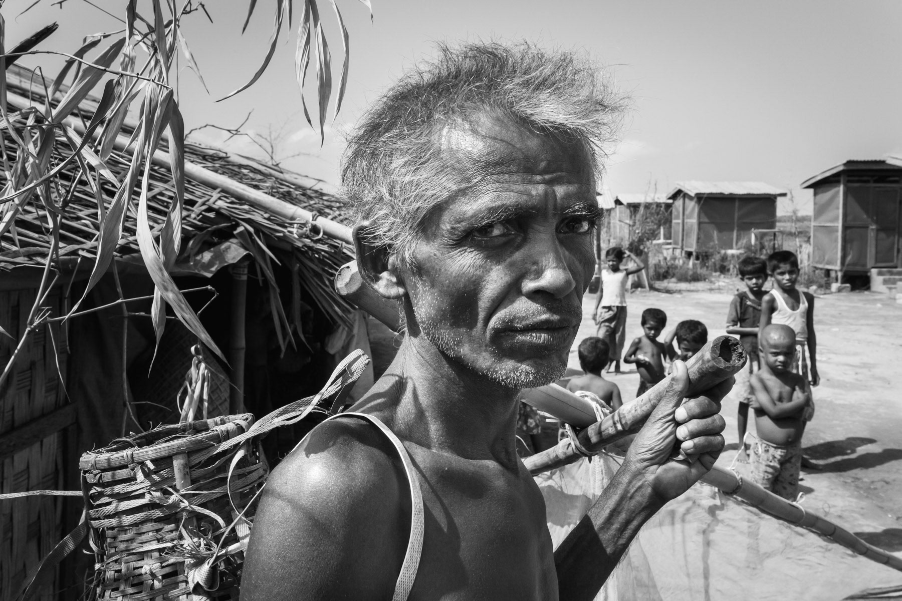 Trying to feed his family by fishing in the surrounding creeks during the rainy season. Motin Nya camp for displaced Rohingya, Sittwe township, Rakhine, Myanmar, May 2016