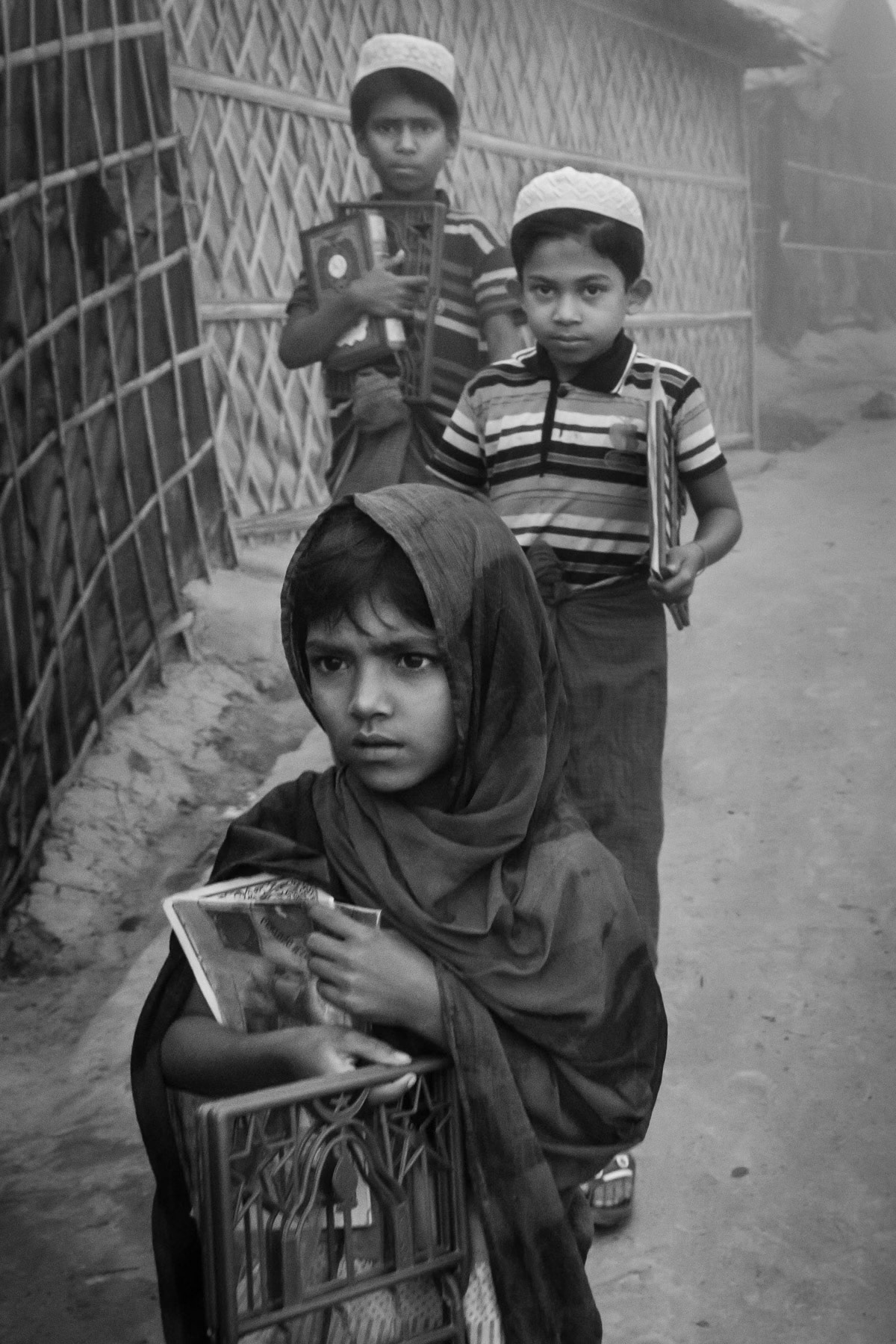 Rohingya children on the way to the medressa during the early morning hours. Thangkhali refugee camp, Ukhiya, Bangladesh, March 2018