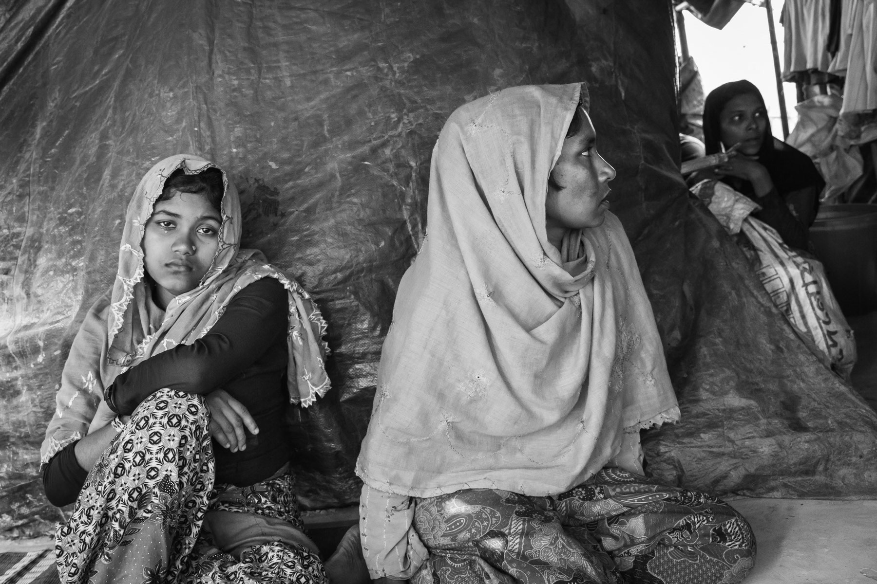 Sufayra Begun (left) and Fatima Khatun (right), respectively 20 and 28 years, from Chut Pyin, Rathedaung. Survivors of the Chut Pyin massacre and victims of extreme sexual violence. Chut Pyin village is one of the numerous Rohingya villages that have been totally wiped out and where severe acts of ethnic cleansing with genocidal intend have been committed by the military and local Rakhine mobs. Hundreds of Rohingya have been massacred and dozens of women have been gang-raped in this village alone. Tangkhali camp, Bangladesh, March 2018