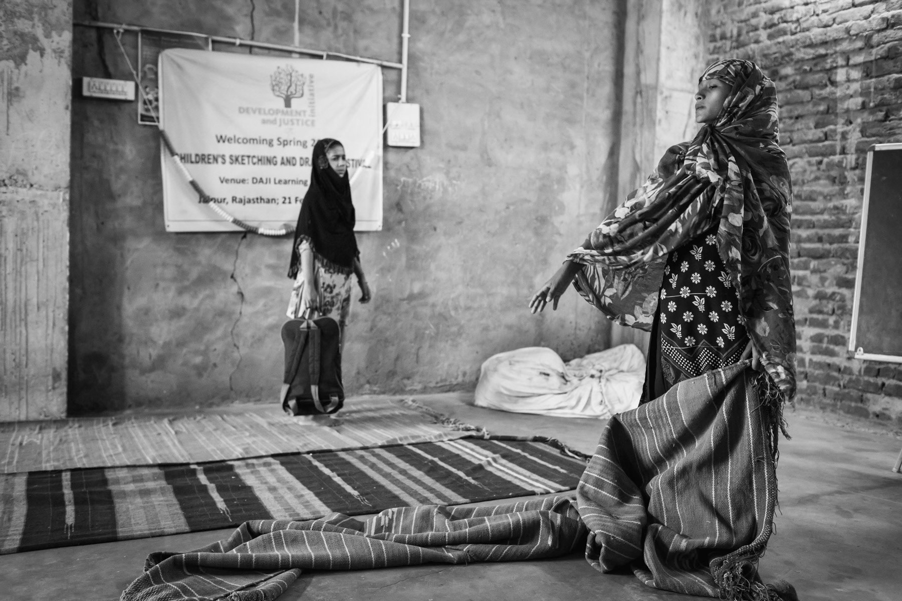 Preparing for the class. After school in an unfinished building for Rohingya children. Hasanpura neighborhood, Jaipur, India, June 2016