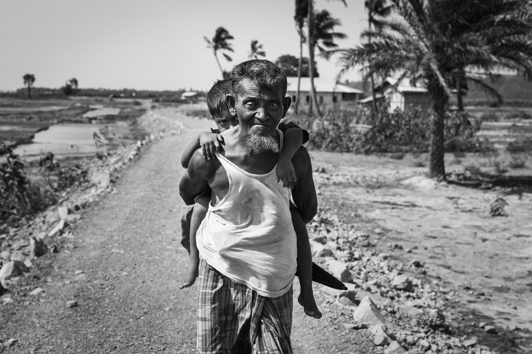 Access road to Kyin Ni Pyin, a place similar to a concentration camp for forcibly displaced Rohingya population who is not allowed to leave the camp area. Nearly 8,000 people have been living in dire conditions in this camp since 2012. Kyin Ni Pyin camp in Rakhine, Myanmar, May 2017