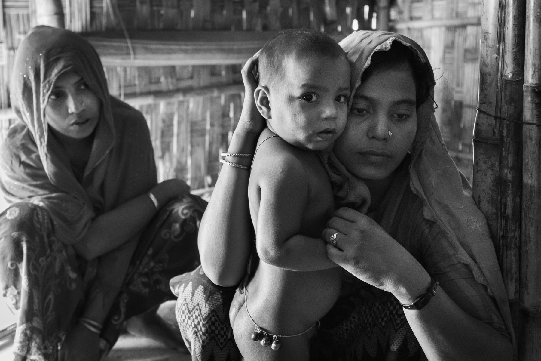 Women of Chut Pyin near Rathedaung in Myanmar and survivors of one of the biggest massacre during the August 2017 onslaught on the Rohingya population of Rakhine. The village has been entirely wiped out, large scale mass rape and executions have taken place, carried out by local Rakhine mobs supported by the regular Myanmar army. Thangkhali refugee camp in Bangladesh, October 2018
