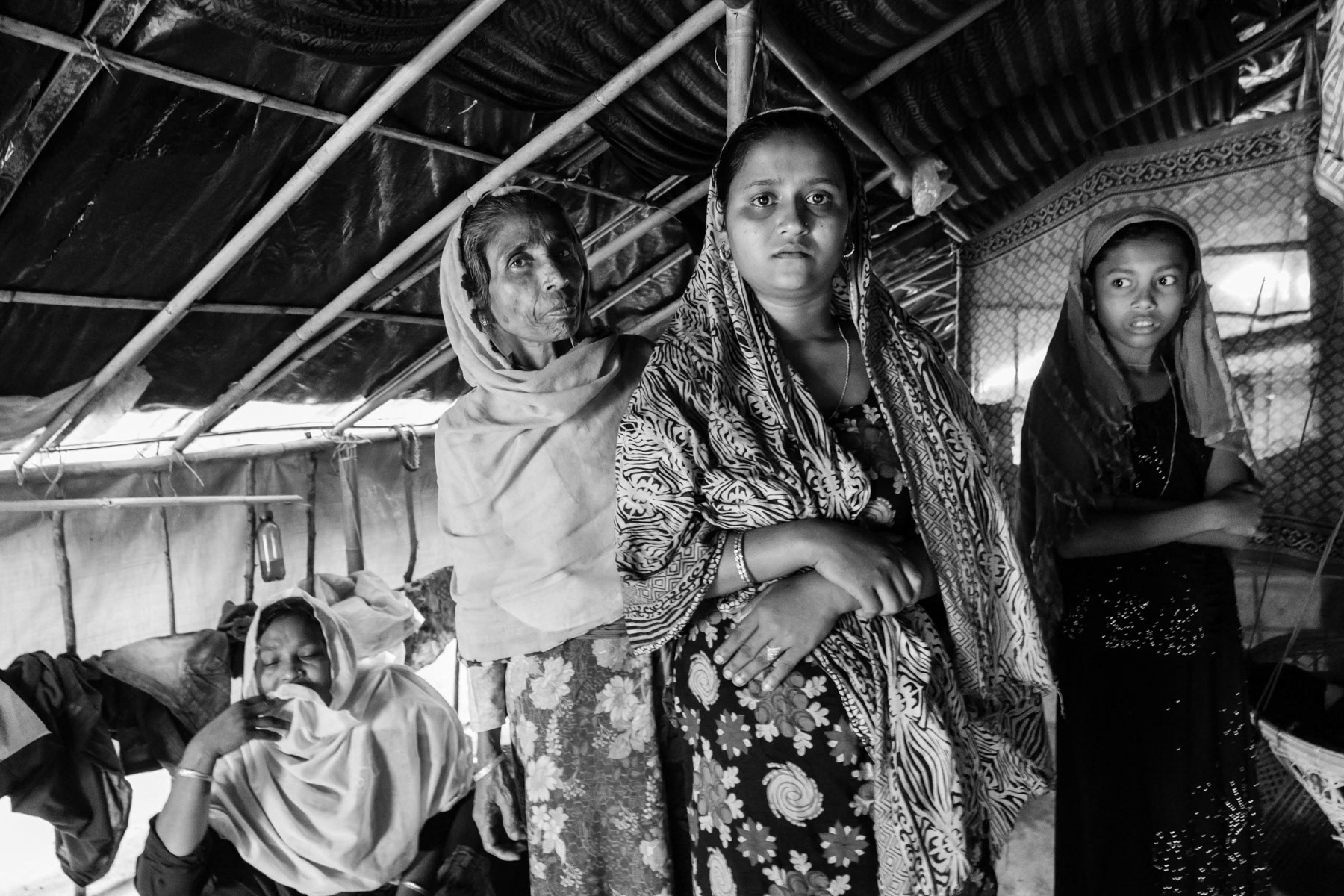 Setera Begum fled from Rathedaung. When their village was attacked end of August, she got shot in the neck. She has 3 sons and a husband and all managed to reach Bangladesh after 14 days of walk through the forests and mountains. She got the first medical attention 15 days after being shot once passing the border. Kutupalong refugee camp in Ukhiya, Bangladesh, November 2017