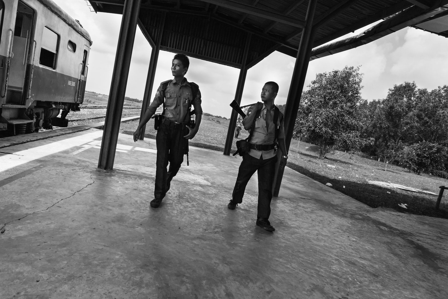 Armed police ready to board the train that will pass through the Rohingya IDP camps on its way to Sittwe. Rakhine, Myanmar, June 2016