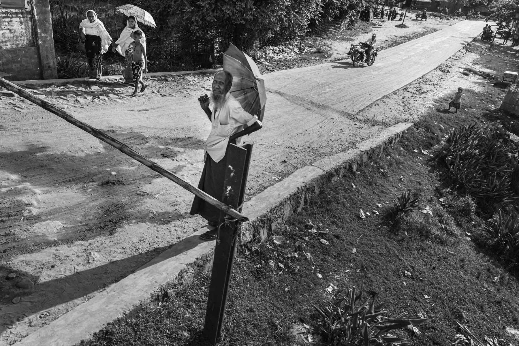 Rohingya elderly watching the train pass by. Sittwe township, Rakhine, Myanmar, September 2019