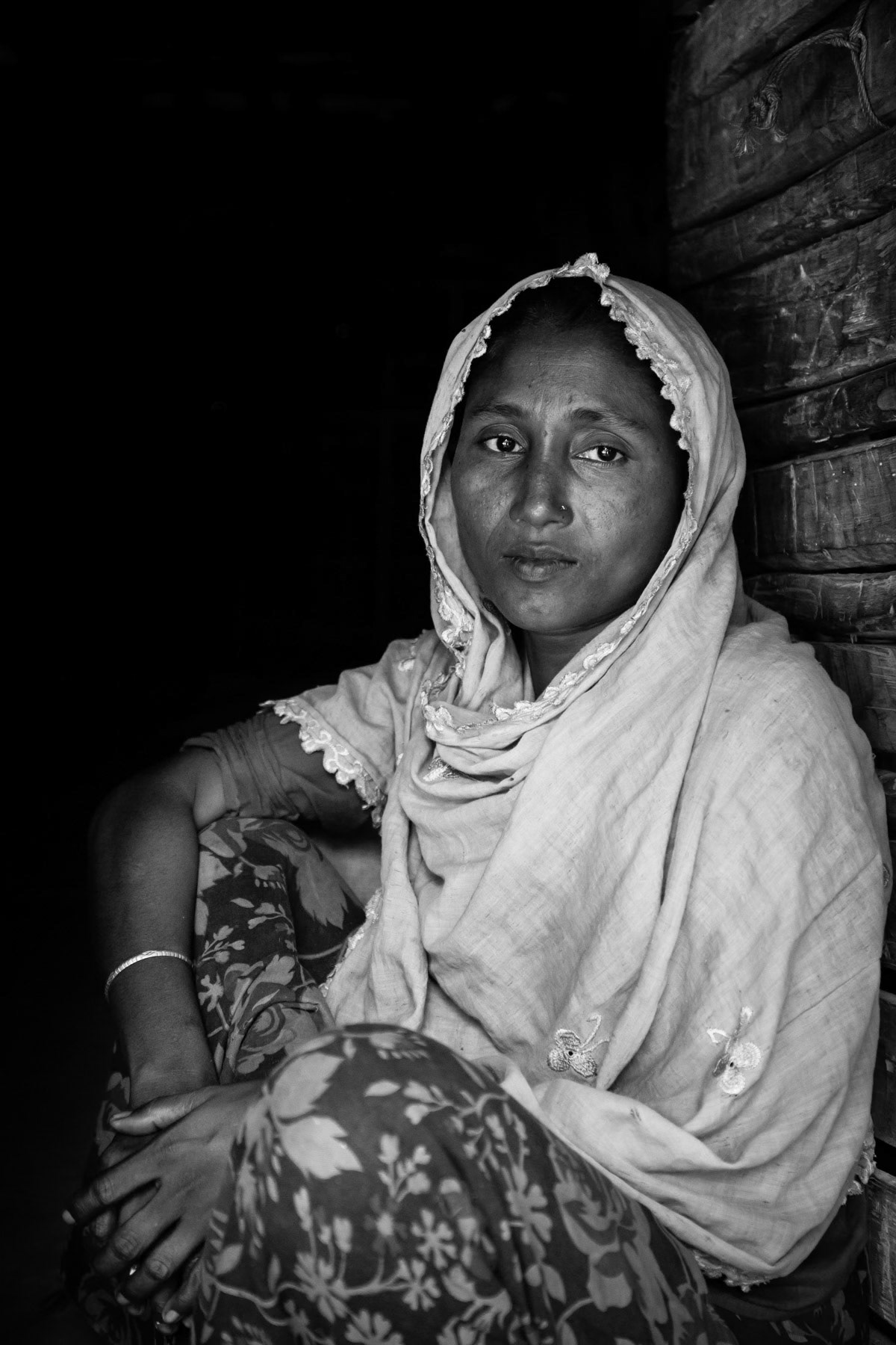 Woman in her makeshift shelter in a camp for un-registered Rohingya in Bangladesh, June 2015
