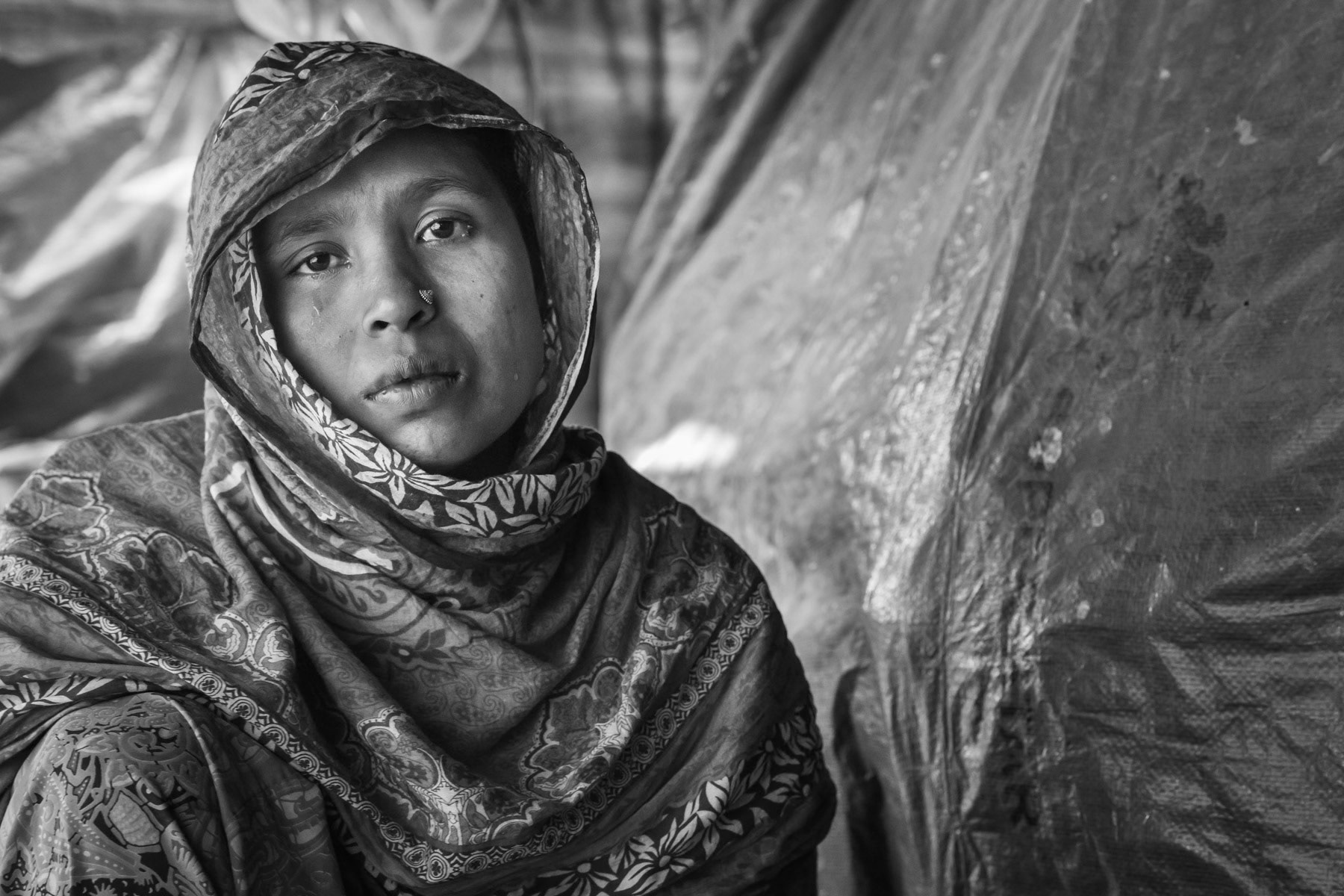 Rape victim, Sufia Khatun, 30 years from Chut Pyin, Rathedaung. She has 3 daughters, one daughter of 14 was gang raped and killed in front of her in the same room where she was raped, by military and local Rakhine which she can identify by name. She has 5 sons that were saved along with 2 of her younger daughters. Her husband was decapitated in front of them. She was gang-raped for a couple of hours by military and local mobs. The main local Rakhine rapists and killers were identified by her by their voice as she was blindfolded and tight while being raped and beaten. She was let go after giving all her gold jewellery and the equivalent of 500 usd in local currency. Two of her brothers and her sister in law were also massacred. Chut Pyin village is one of the numerous Rohingya villages that have been totally wiped out and where severe acts of ethnic cleansing with genocidal intend have been committed by the military and local mobs. Hundreds of Rohingya have been massacred in this village alone. Tangkhali camp, Bangladesh, March 2018
