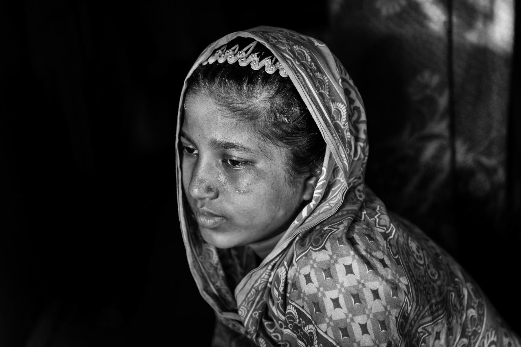 Munuara, 17 years old, is from a village near Rathidaung. Her husband was killed by the Myanmar military, she came to Bangladesh with her neighbour after that. She was beaten and gang-raped for 5 days by military in barracks near Rathidaung. Twenty other Rohingya girls were also present in the building and raped by a group of approx 30 military. She escaped after the military moved on to another location. Countless rape allegations have been consistently reported during the past months, an accusation the Myanmar authorities deny. Mass rape is often used during ethnic cleansing campaigns, both acts consitute crimes against humanity and war crimes when carried out by military personnel. Shamlapur refugee camp, Bangladesh, May 2017