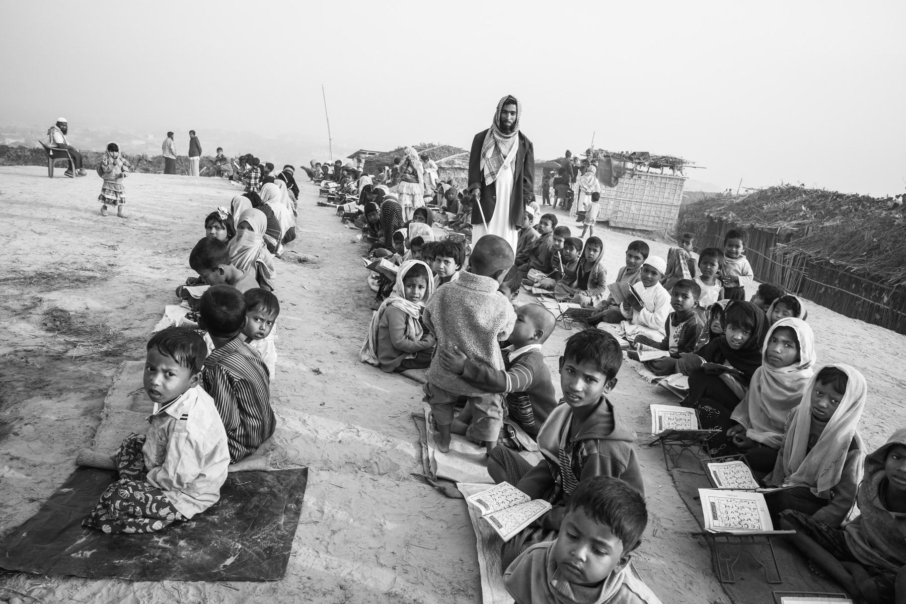 Improvised coranic school for Rohingya children that arrived from Myanmar during the past weeks. Having no access to formal education, un-registered Rohingya refugees have only the coranic schools as sole form of education. New part of Kutupalong refugee camp for newly arrived refugees from Myanmar. Cox's Bazar, February 2017