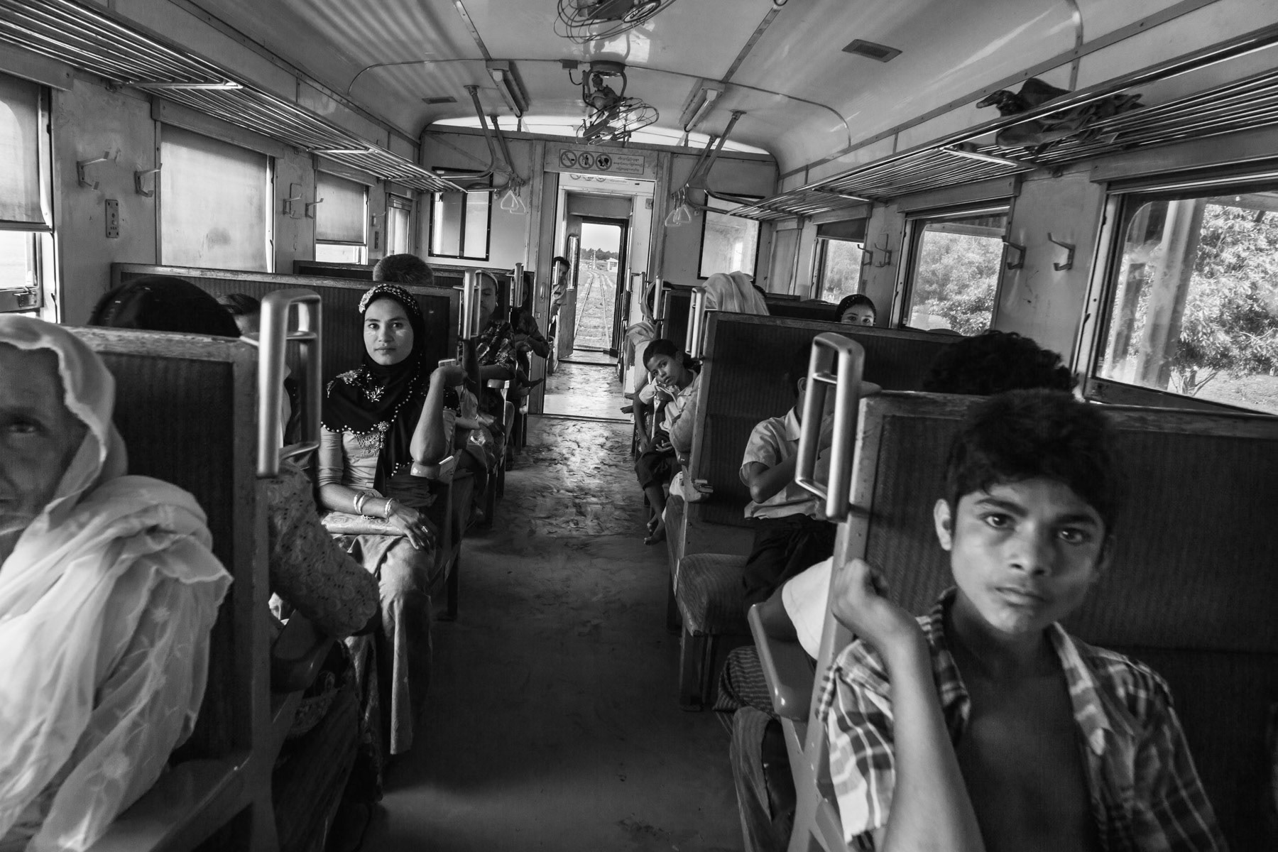 Rohingya IDPs in their allocated space in the train running through the IDP camps and villages north of Sittwe, Rakhine, Myanmar, June 2016