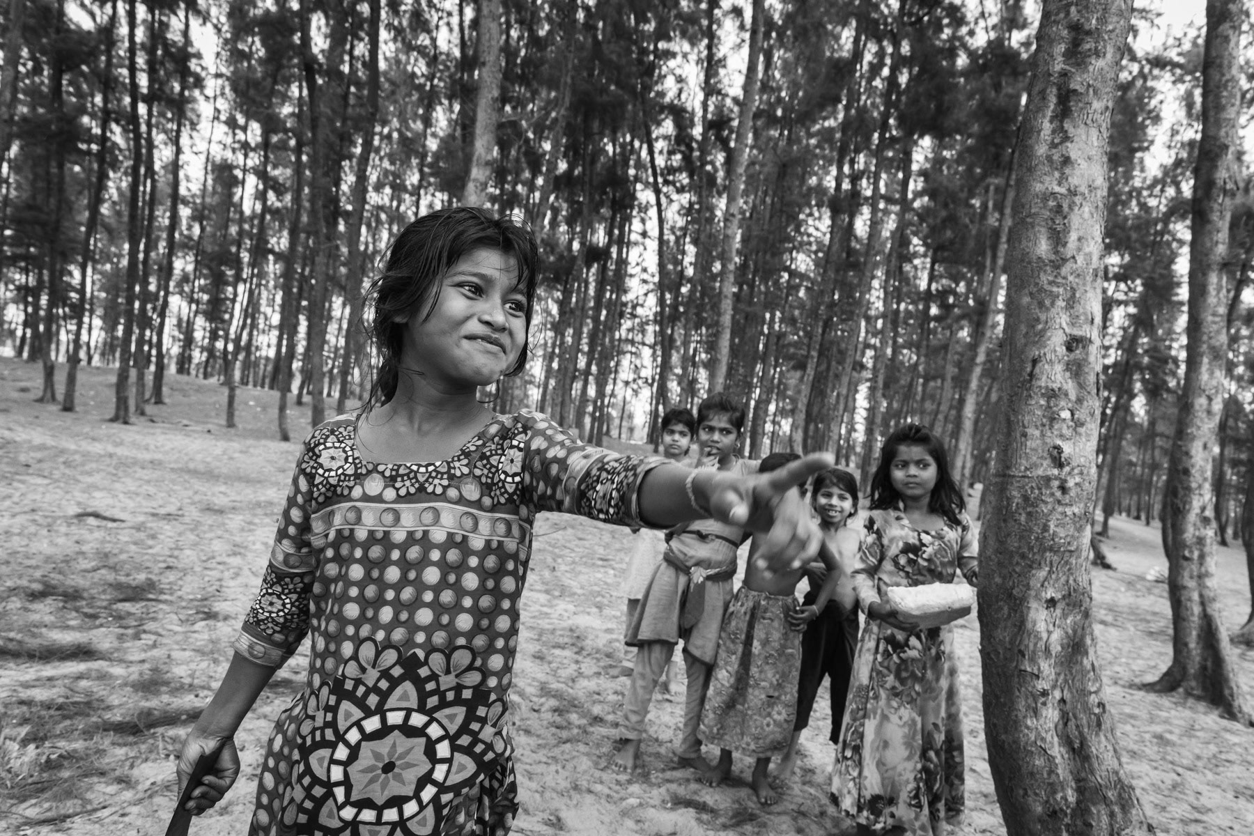 Rohingya children collecting pine needles and fire wood that will be used for cooking. Shamplapur beach area, Bangladesh, March 2018