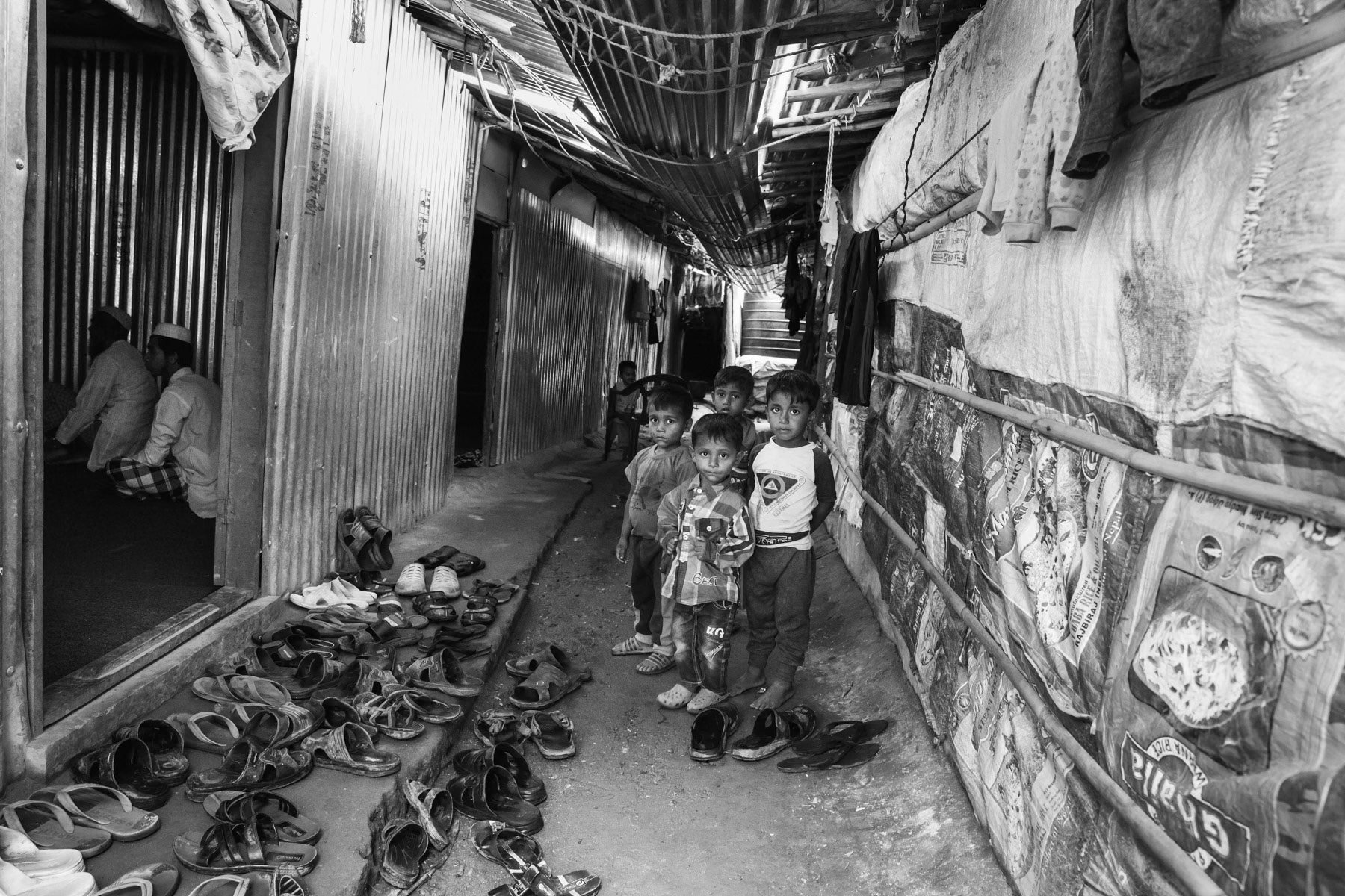 Rohingya children in front of a makeshift mosque used for the Friday Prayers. Kapan makeshift camp for Rohingya refugees from Myanmar, June 2017