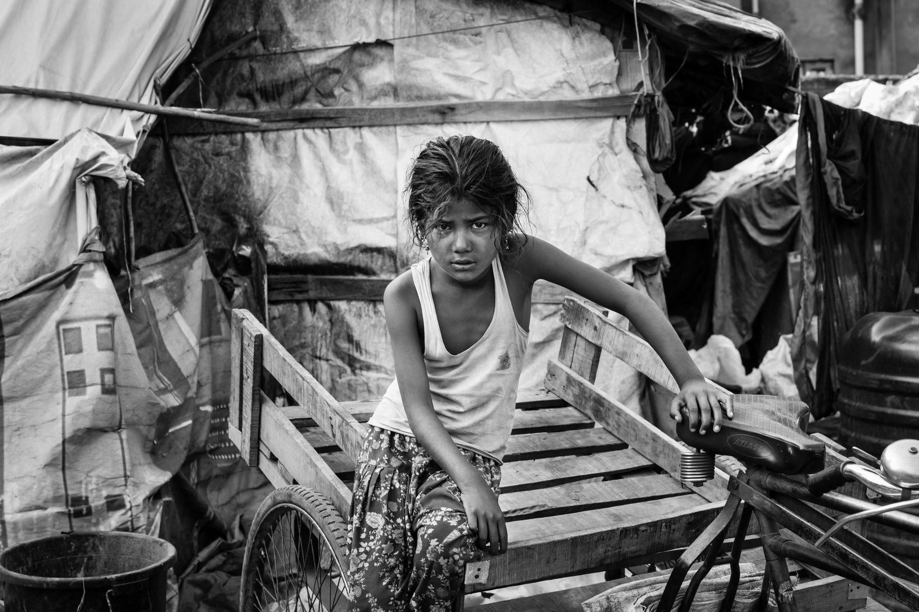 Rohingya child working as waste picker, a lot of Rohingya refugees work as waste collectors in Jammu. Jammu and Kashmir province, India, June 2017