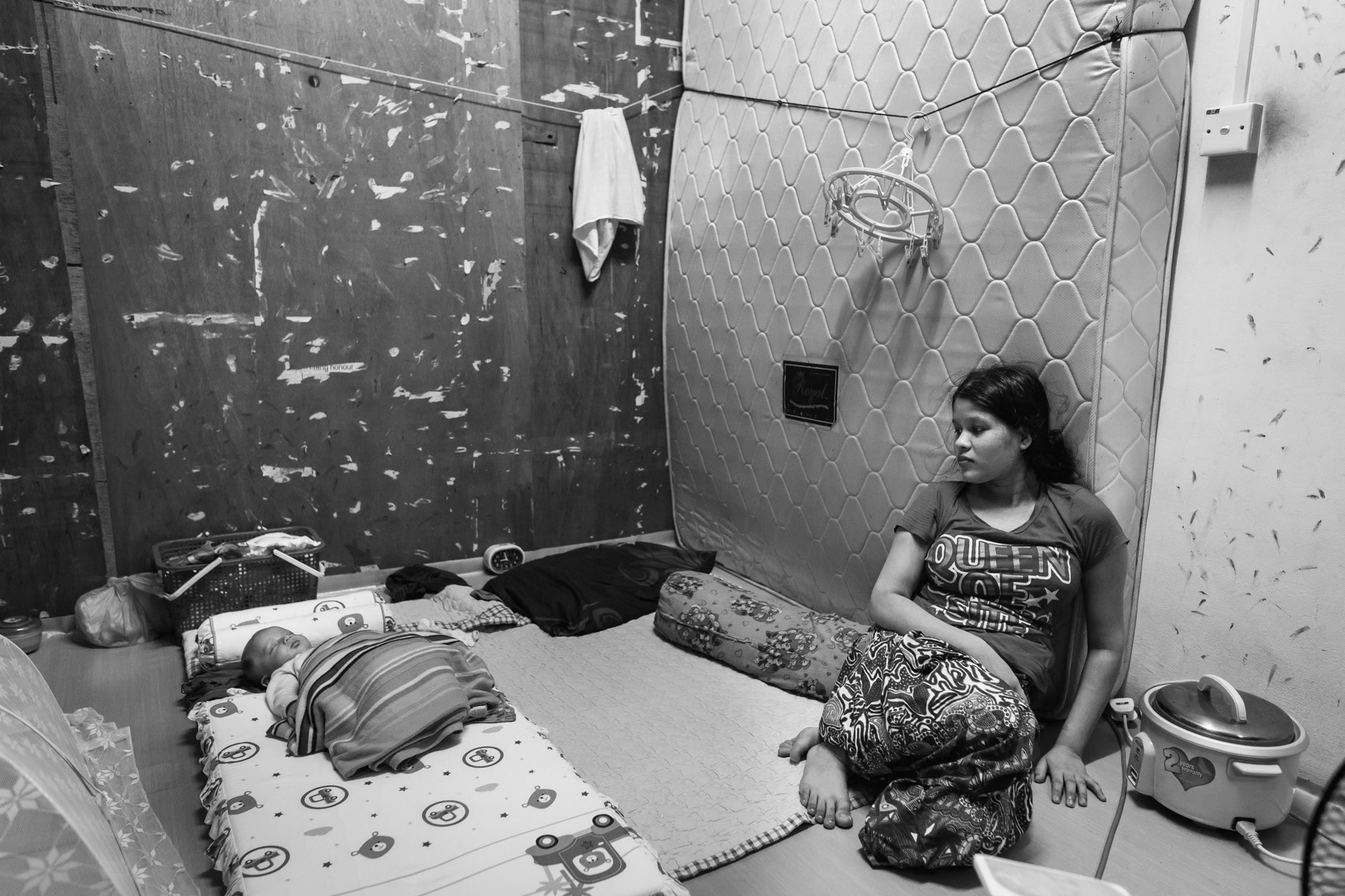 Family room in a building hosting Rohingya refugees working in the nearby wholesale market. Klang, Malaysia, June 2016