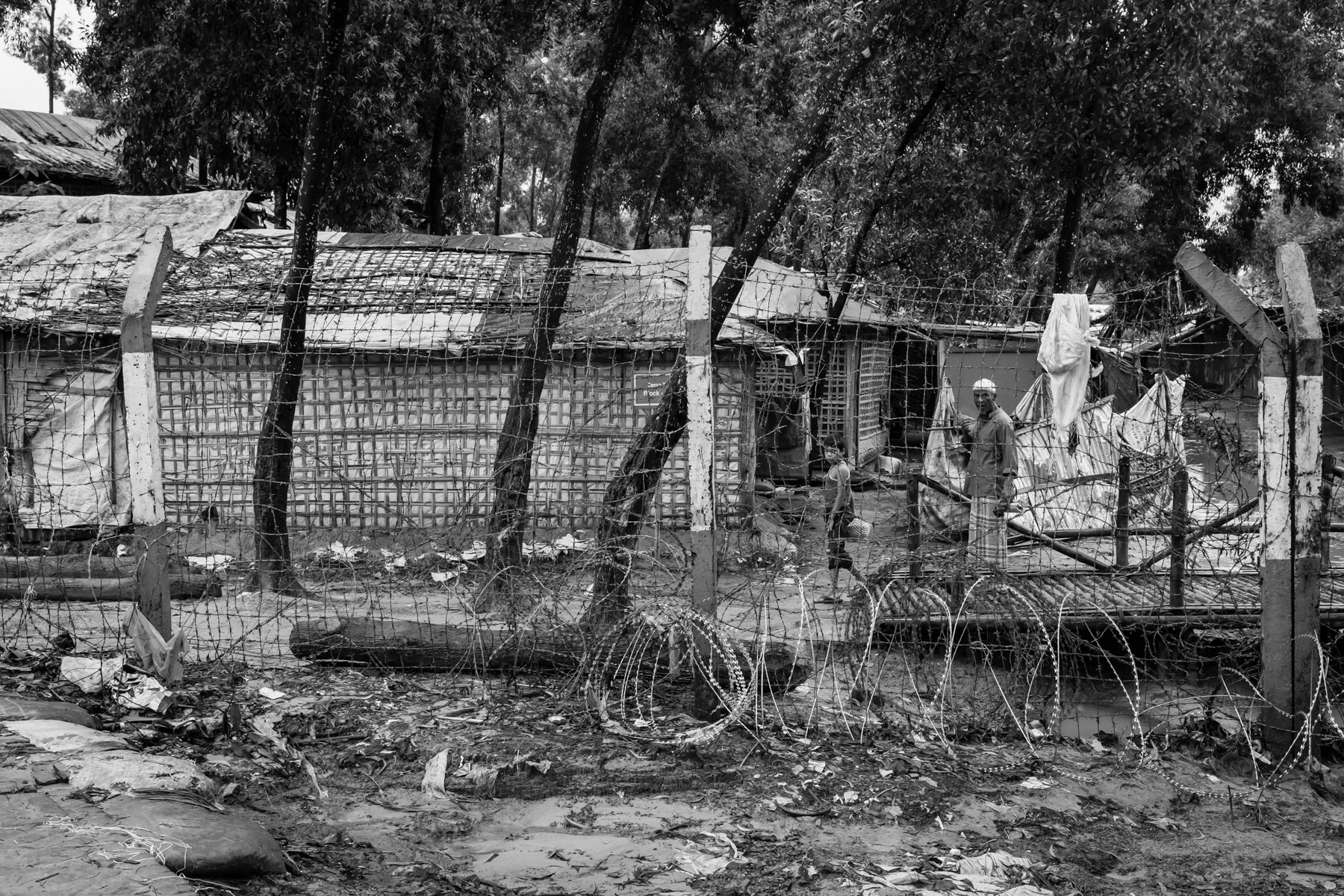 Fences, barbed wire and watch towers are surrounding the refugee camps making it very hard to reach clinics, stores and commodities located outside the camps. After living for more than 5 years in limbo it is very unreal to see any perspective of returning to their homeland or being re-settled in a third country for the growing population of over one million Rohingya refugees. Kutupalong refugee camp, Cox's Bazar, Bangladesh, September 2022