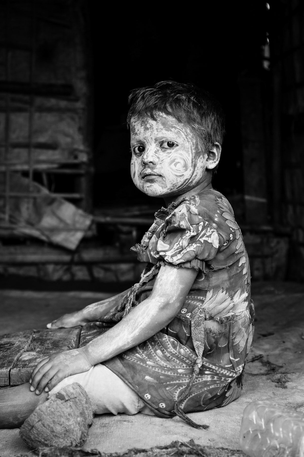 Rohingya girl with traditional thanaka powder. Thanaka is made from wood and beside cosmetic beauty it protects from sunburns and removes acne. Thau Chuang camp for forcibly displaced Rohingya near Sittwe, Myanmar, September 2015