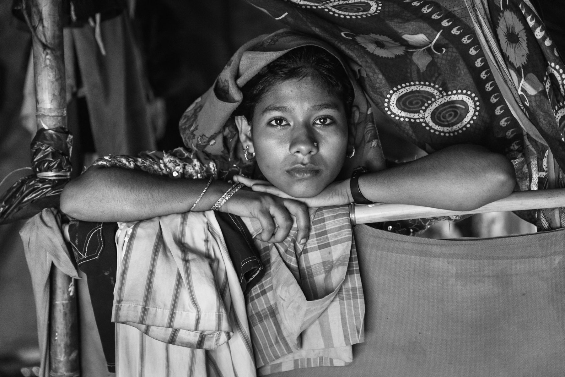 Rohingya refugee from Shilhadi in Rathedaung township. Their village was attacked begining September 2017 by military forces. The village was attacked by at least 100 military forces aided by local Rakhine extremists. The extremists were decapitating people. Eight hundred Rohingya, mainly landowners and agriculturors were living in her village, all fled or were killed and the village was burnt down. It took her 18 days to reach Bangladesh helping her sister who had been shot in the leg. Kutupalong camp, Cox's Bazar, Bangladesh, November 2017