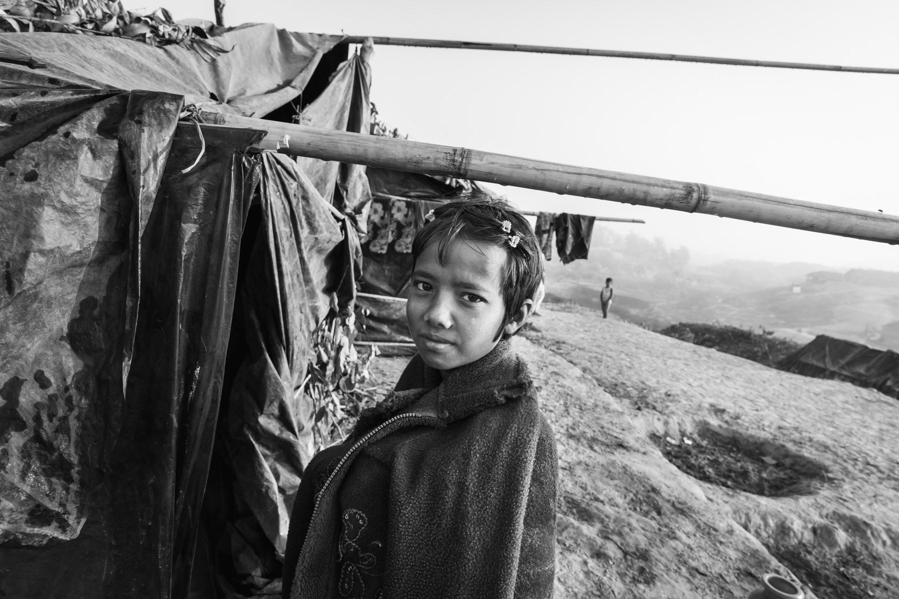 Rohingya girl that arrived few days ago with her family fleeing persecution and ethnic cleansing campaigns in northern Rakhine. Kutupalong refugee camp, Bangladesh, February 2017