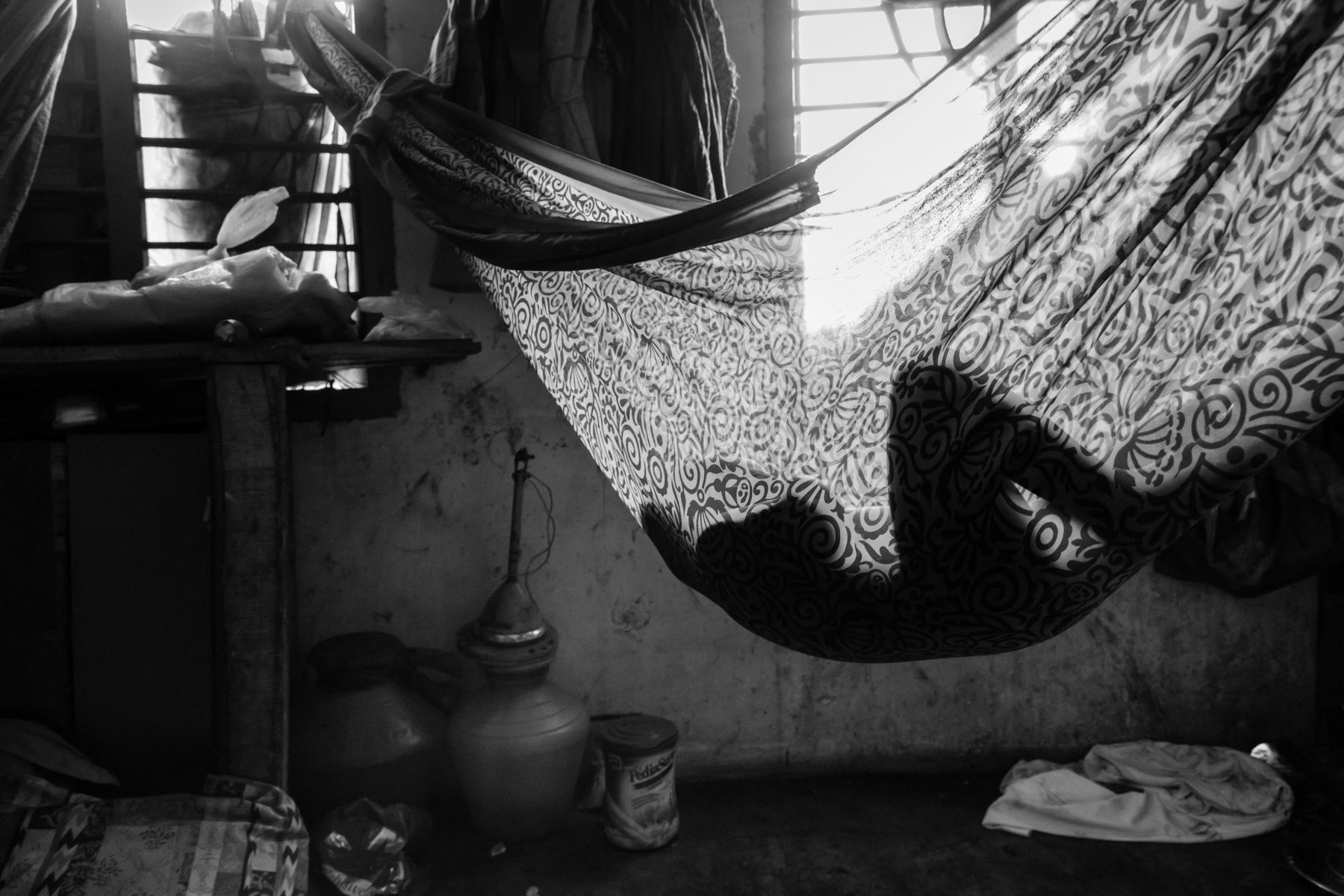 Child sleeping in accomodation provided for 20 Rohingya families in a decommissioned cyclone shelter along the Indian Ocean. An estimated 15 to 20,000 Rohingya live in India. Chennai, India, June 2017