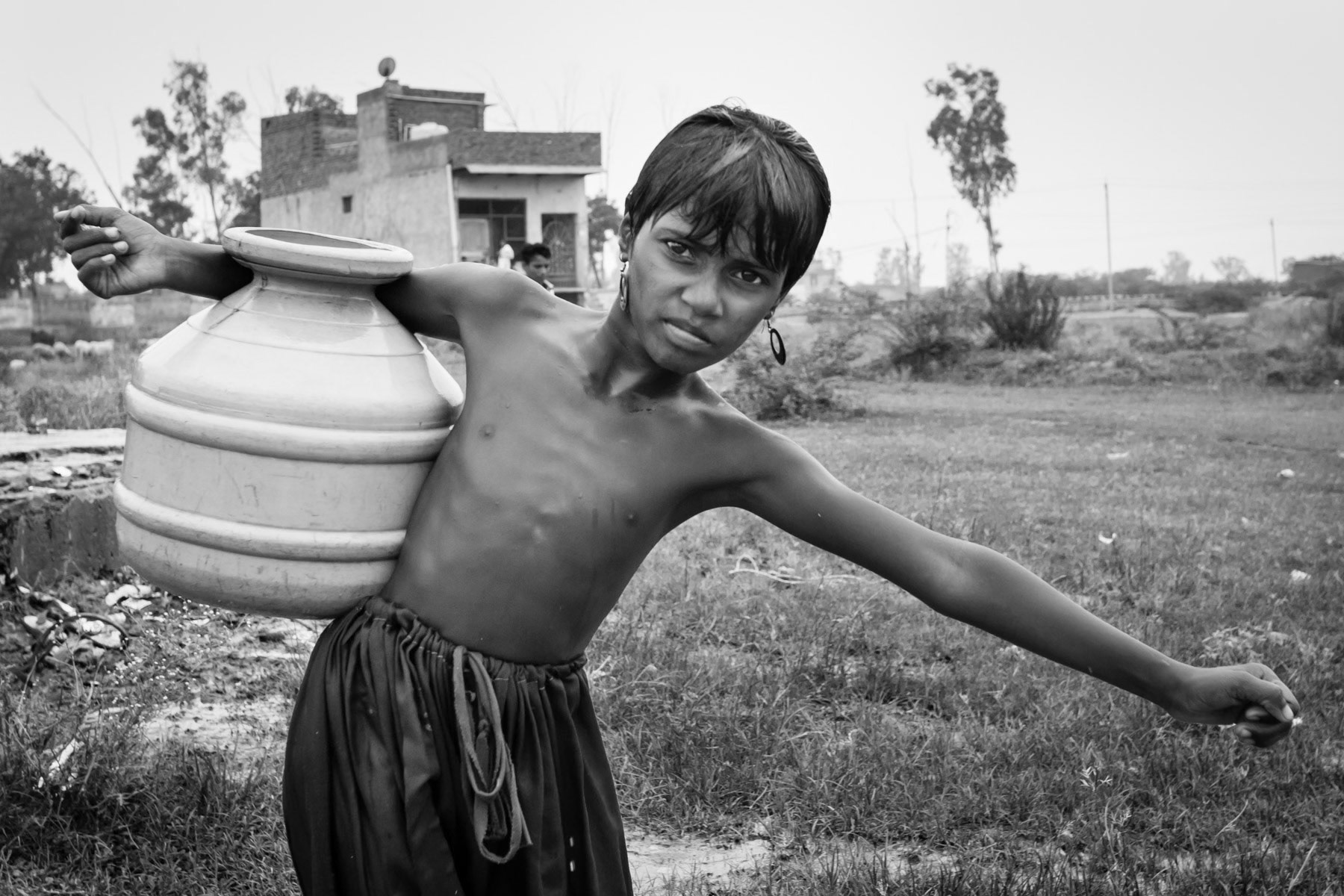 Carrying precious and scarce water. Rohingya settlement in Mewat, Haryana, India, June 2016