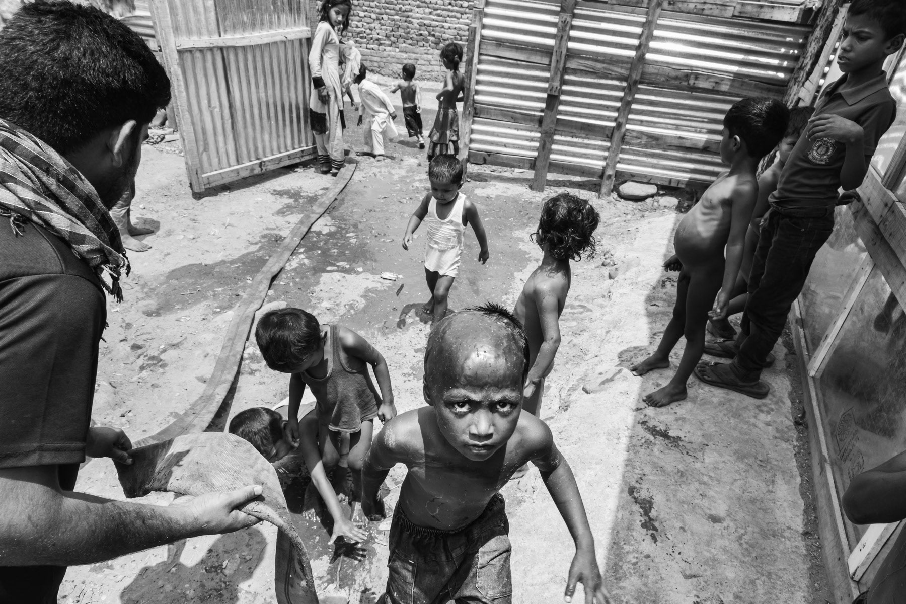 Water supply to one of the Rohingya camps that was recently destroyed by a fire. Rohingya have recently been victim of hate campaigns in Jammu & Kashmir where approximately 7,500 Rohingya live since 2012. Many are moving to other cities in India since 2017 fearing for their life. Narwal neighbourhood in Jammu, India, June 2017