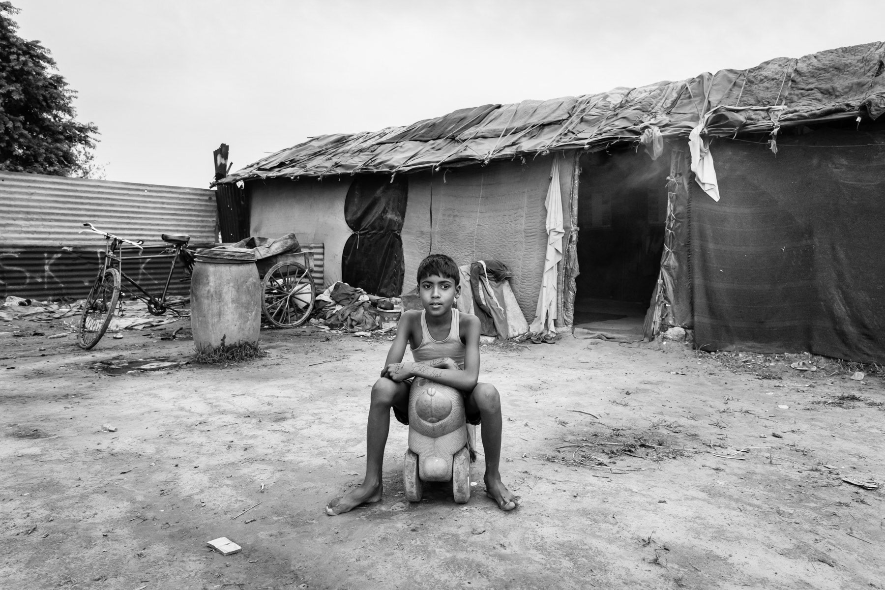 Mujeri camp, a new camp established in 2016. Fifty Rohingya families are enslaved and "owned" by Ali Hussein a Rohingya from Bangladesh exploiting his own people in India. The ones victim of bonded labour are extremely vulnerable and face an almost impossible task to buy themselves out of this situation. Although illigal, bonded labour practices are still widespread and rarely stopped by the authorities. Faridabad in Haryana, India, June 2017