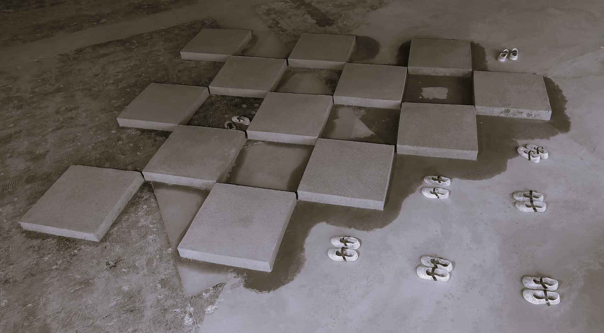 Sand tiles and tissue paper shoes