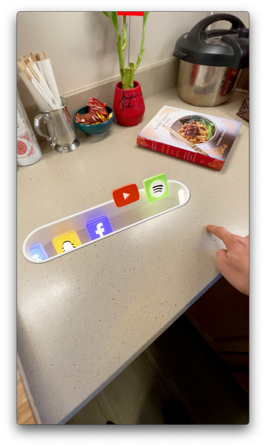 Moving their hand left or right of the original contact point scrolls the carousel