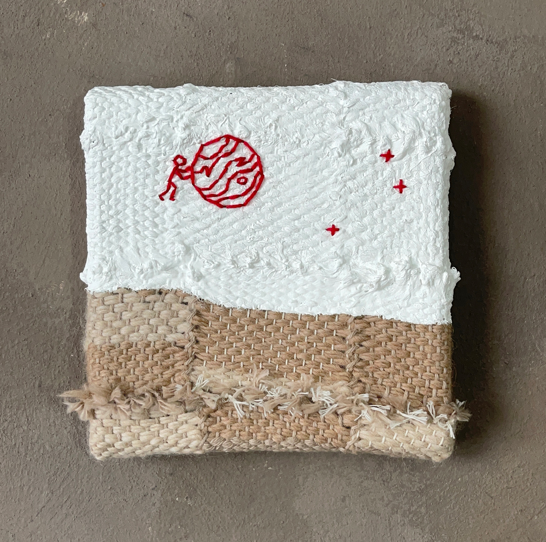 HE'S STILL TRYING TO GET JUPITER ACROSS THE SKY yarn and acrylics 2025, 15 x 15 cm