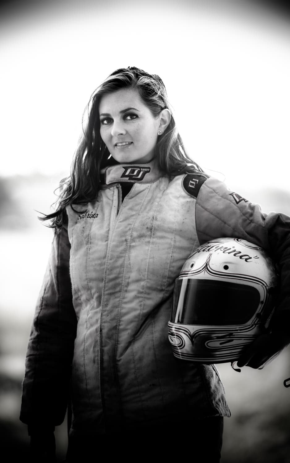 Sabrina Pecora Drag racer standing with helmet