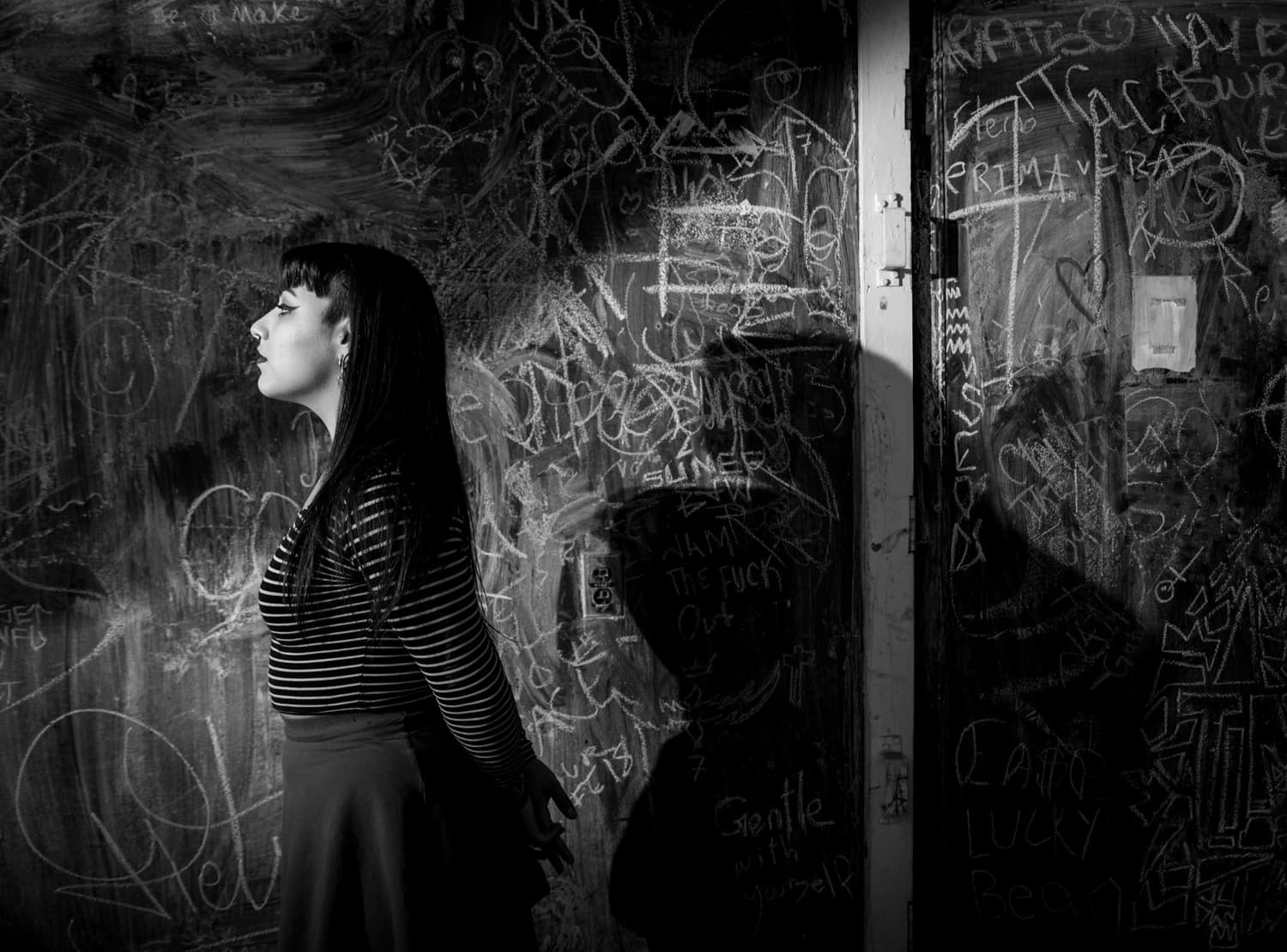 Brittany Newman standing by chalkboard