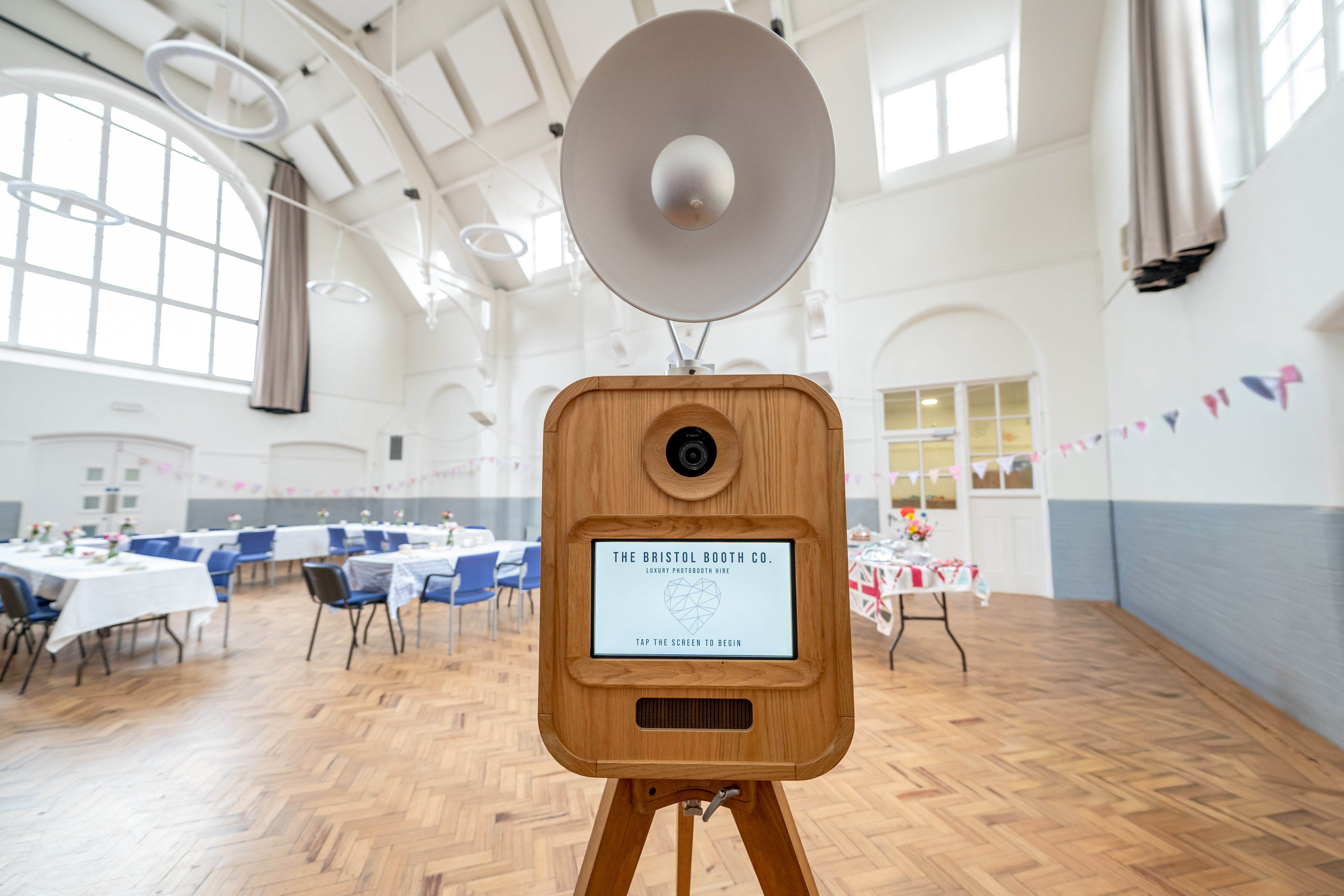 Handcrafted vintage solid oak photo booth with professional studio flash at a luxury wedding reception.