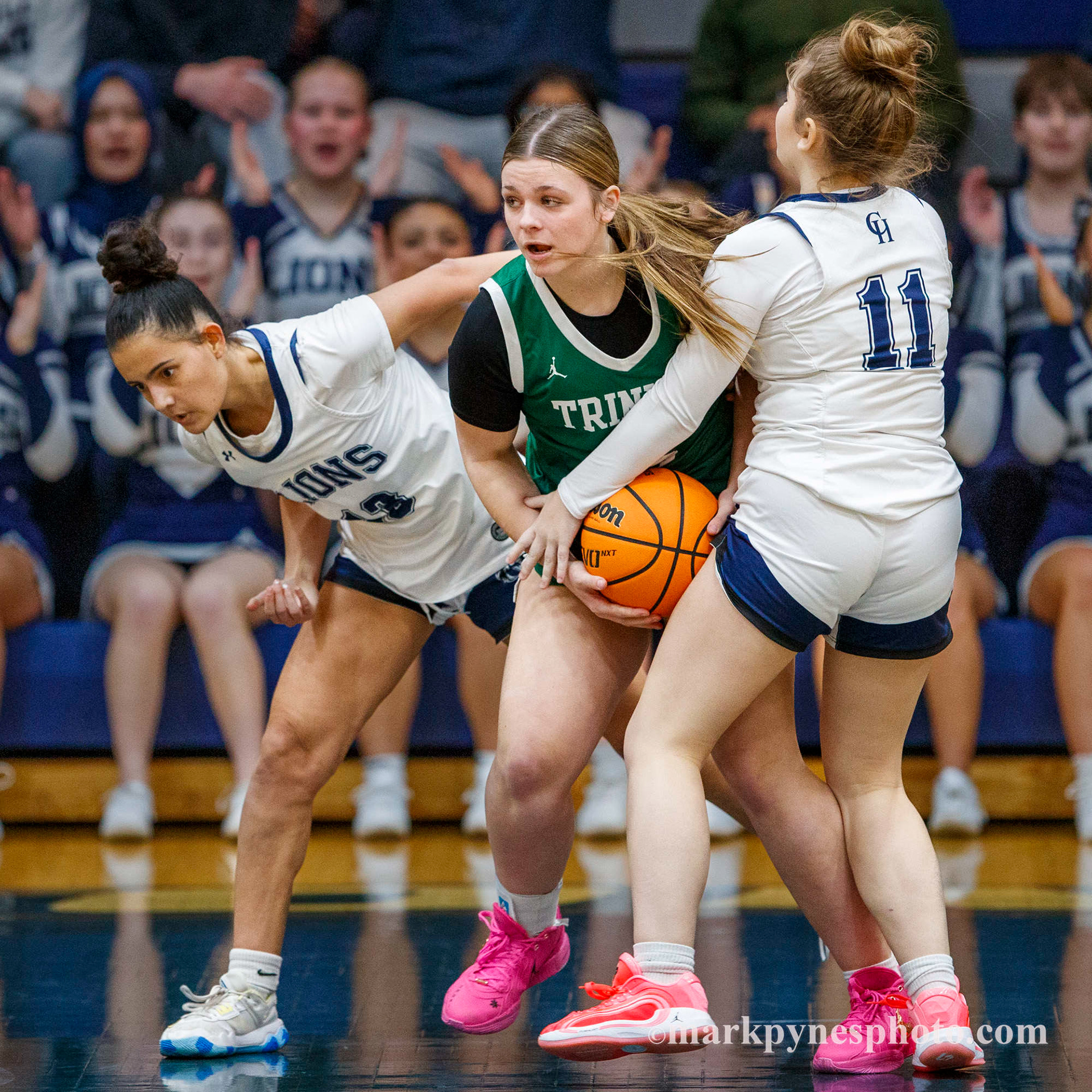 Camp Hill’s Cecilia Benavides and Jillian Hoke pressure Trinity’s Lillian Kertis, but Trinity wins, 61-16.