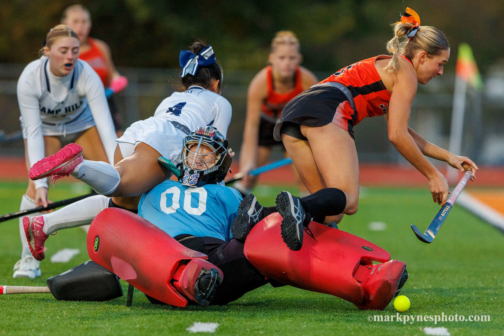 Camp Hill's Anna Doi and Susquenita's Braelyn Prinz fly over Camp Hill goalie.