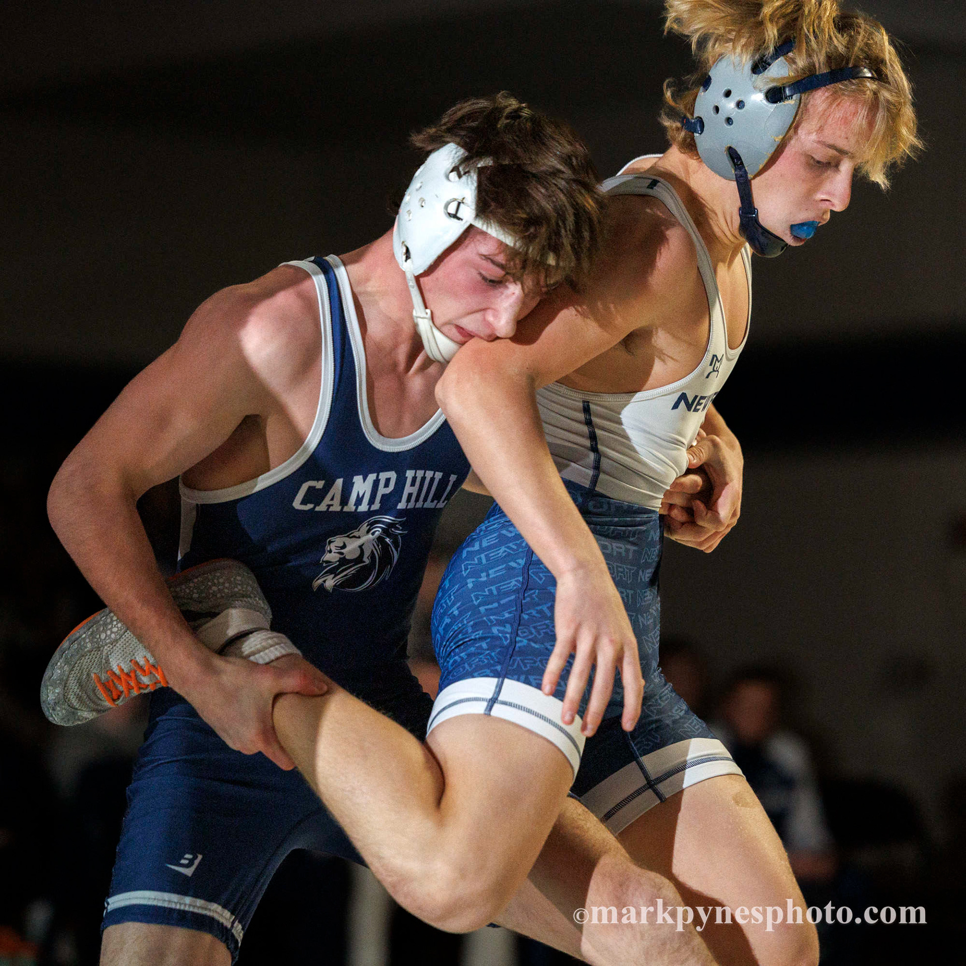 Sam Miller, Camp Hill, tries to take down Newport’s Chris Imler, in the 133 pound match, won by Imler in overtime.