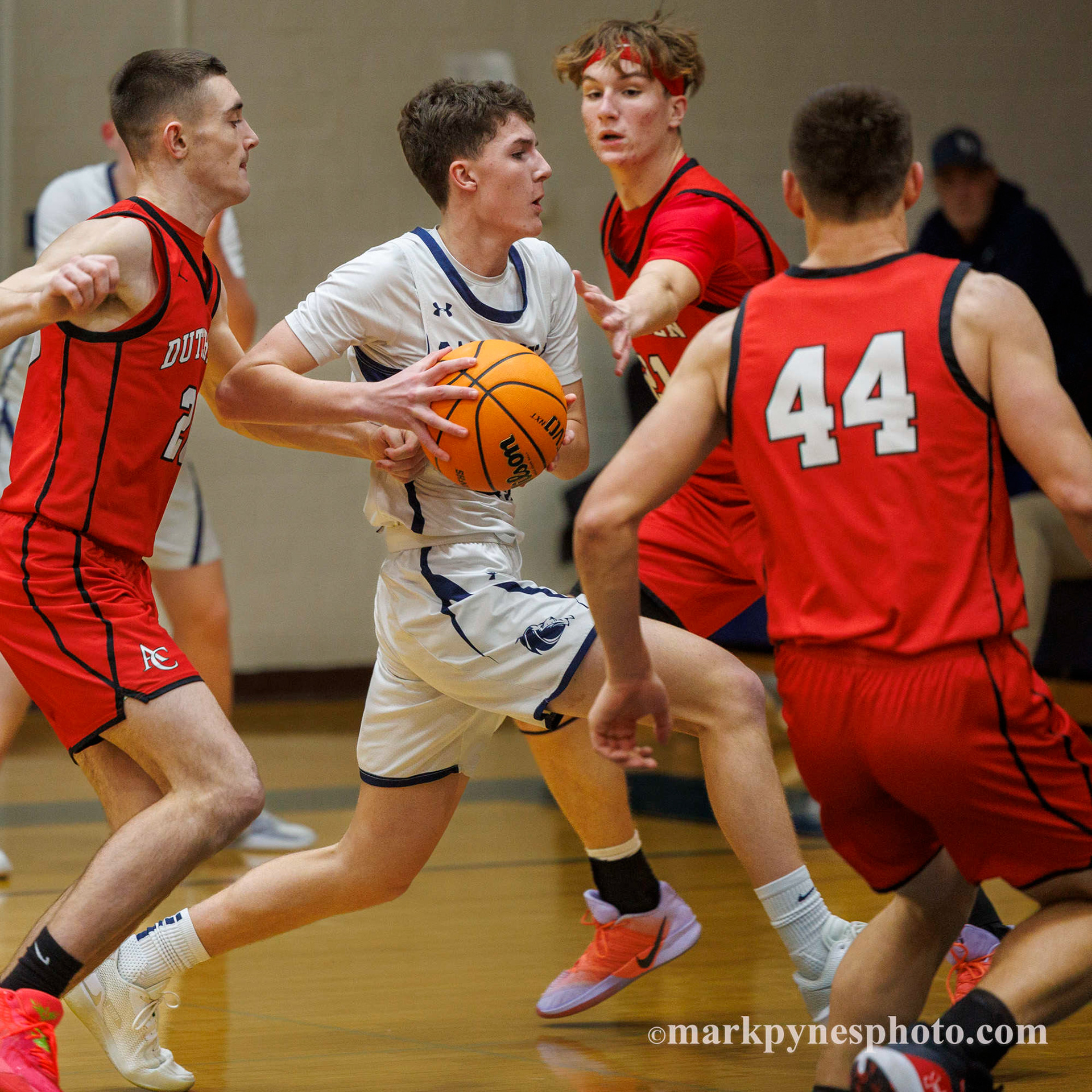 Luke Bowser drives through Annville-Cleona defenders Danny Shay, James Garney and Hudson Sellers for a layup.