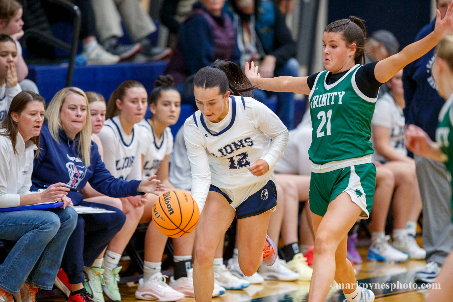 Cecilia Battisti drives up court under heavy defense from Kenzie Fox, and Trinity wins 61-16, in Camp Hill, Pa., Dec. 9, 2025.