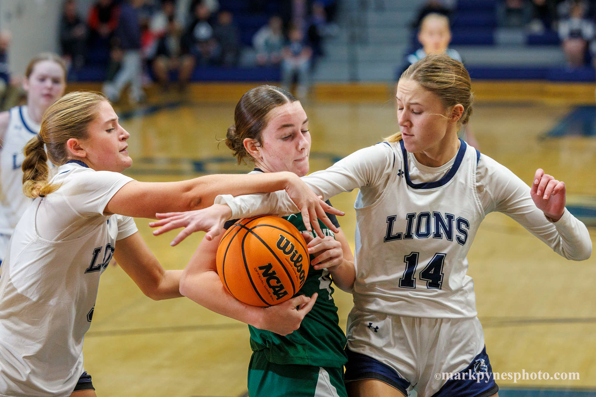 Camp Hill’s Natalie Kunkle and Camden Werley fight for a rebound with Trinity’s Emma Grace, but Trinity wins.