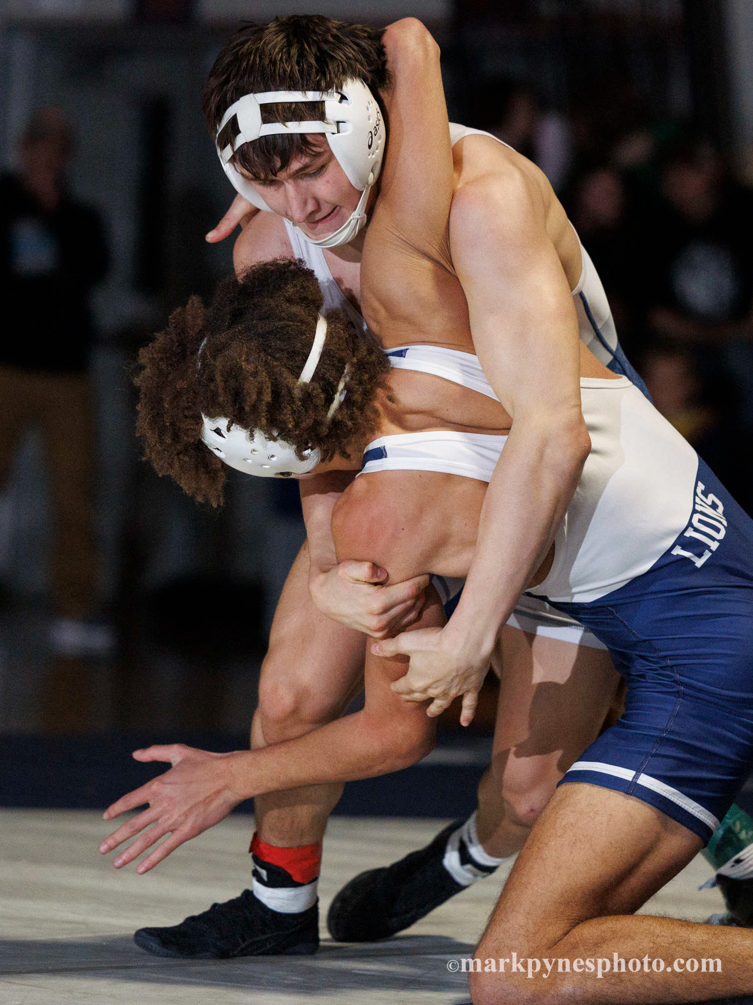 Newport’s Braxton Kerr works towards a pin of Camp Hill’s Ken Dawes, in the 160 pound match.