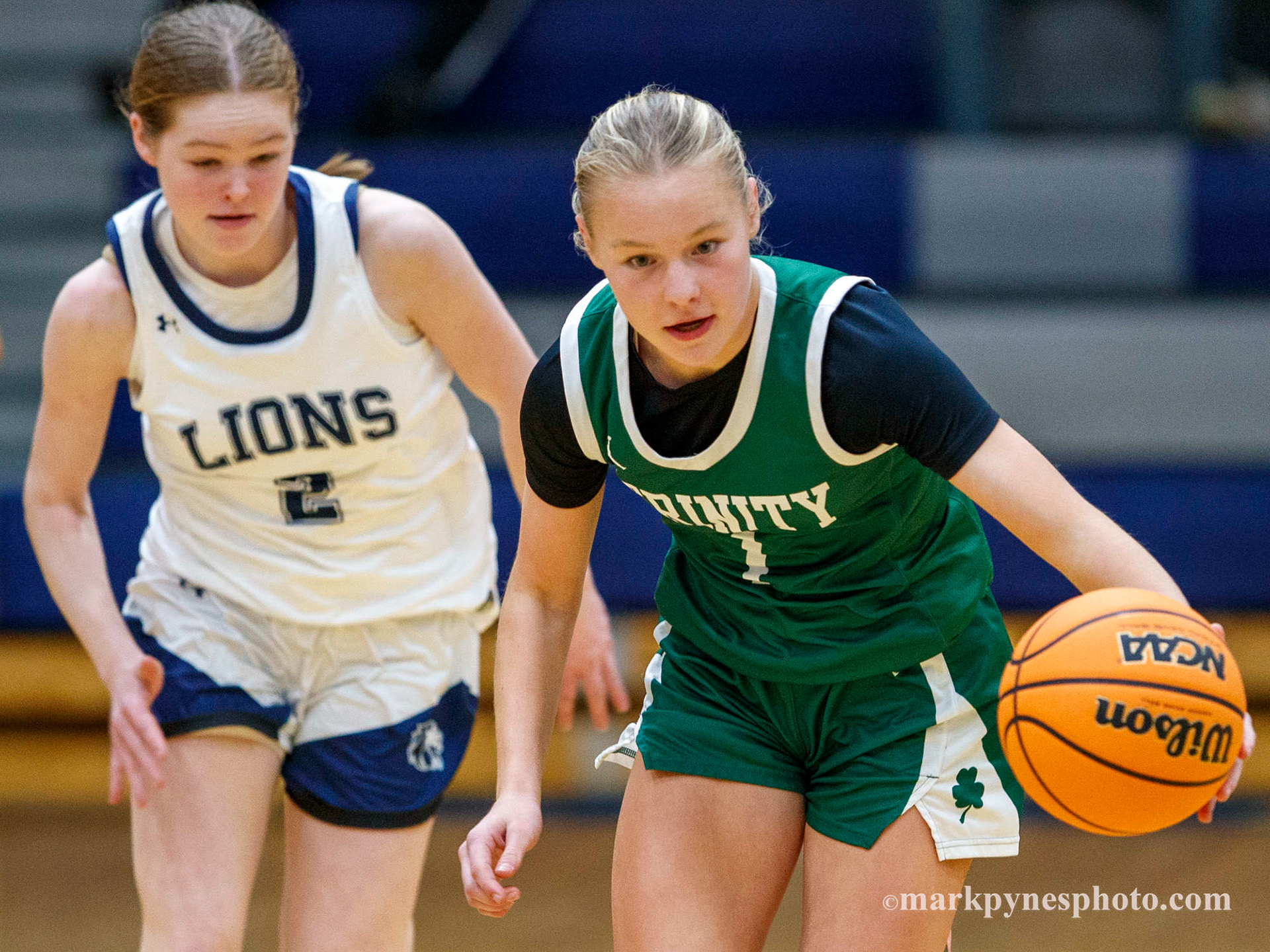 Rhory Bendick, Camp Hill, pursues Trinity’s Charlotte Fry, but Trinity dominates the Lions, 61-16.