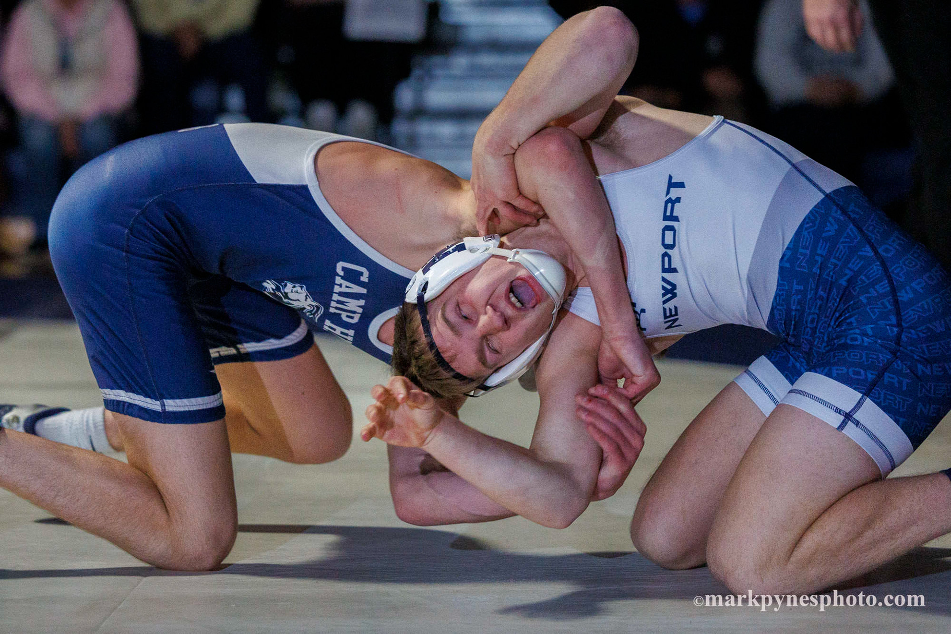 Camp Hill’s Foster Wolgemuth tries to turn Newport’s Marek Polcha, who won by tech fall at 121 pounds.