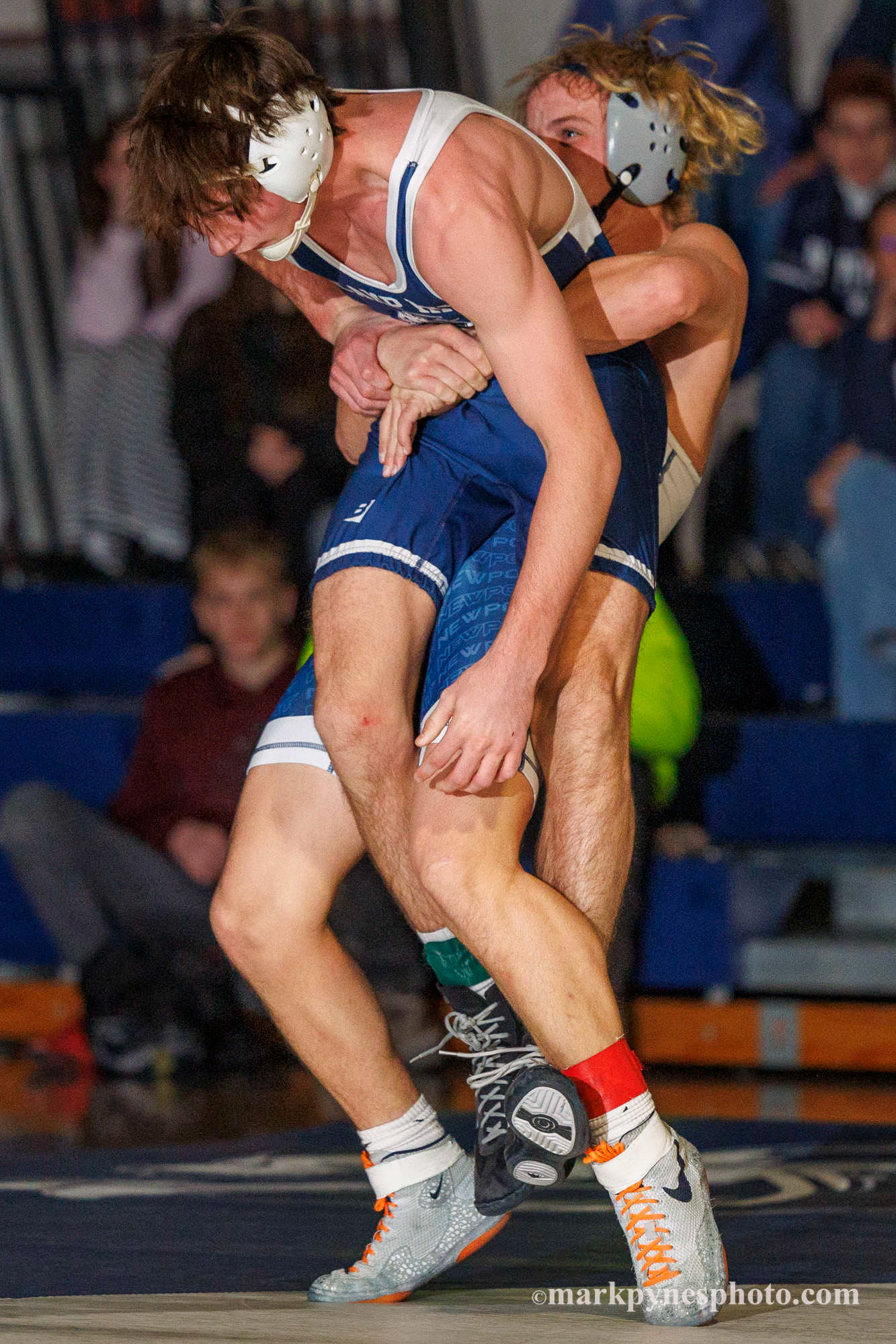 Sam Miller, Camp Hill, is lifted by Newport’s Chris Imler, in the 133 pound match, won by Imler in overtime.