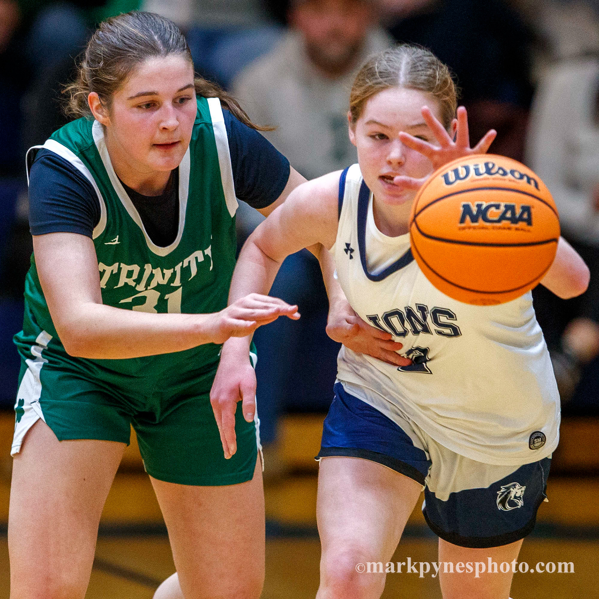 Rhory Bendick, Camp Hill, chases a loose ball under pressure from Trinity defender Aryana McCleary, and Trinity wins, 61-16, in Camp Hill, Pa., Dec. 9, 2025.